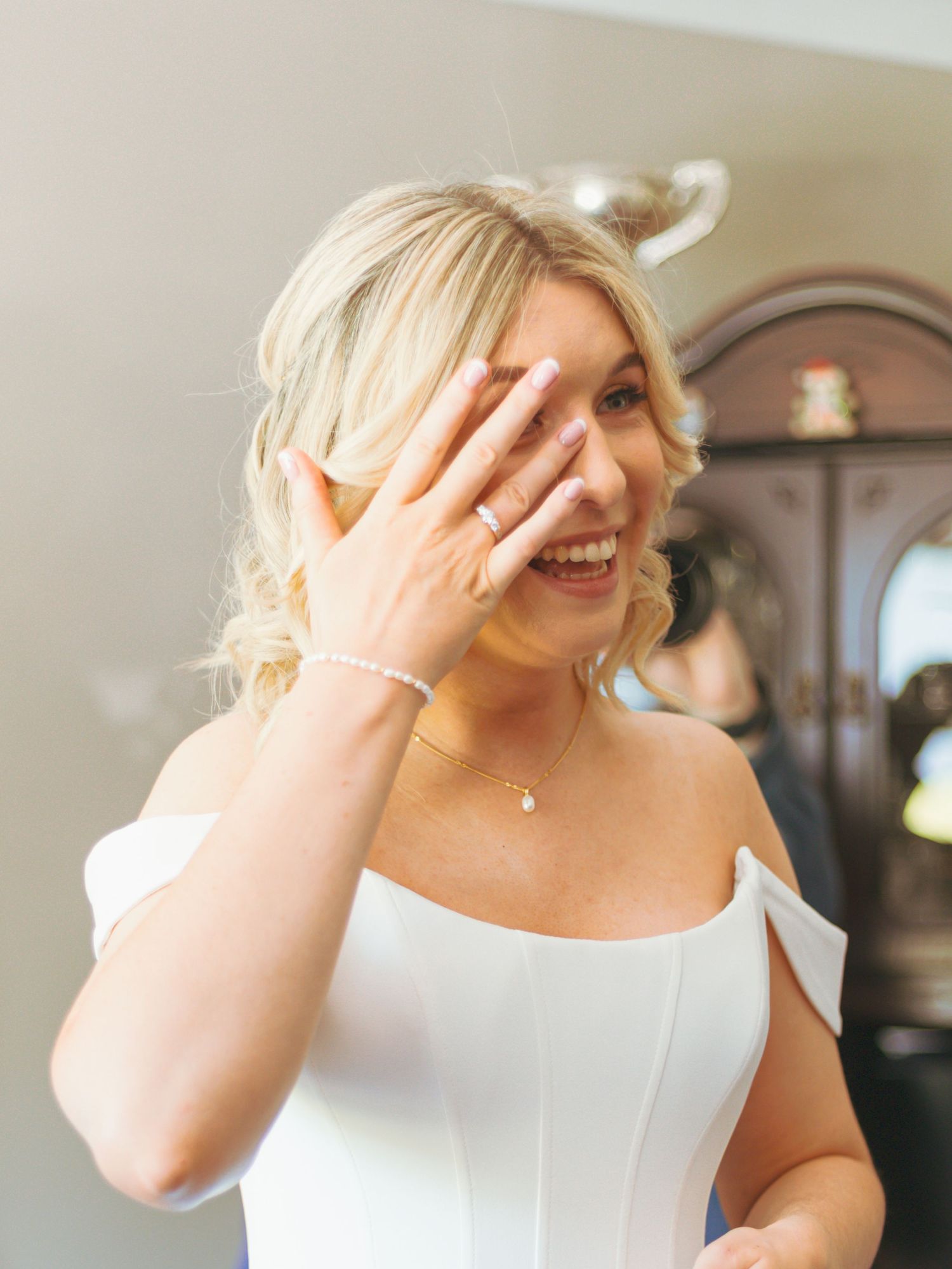 Series of candid moments showing joy and laughter in a white formal dress.