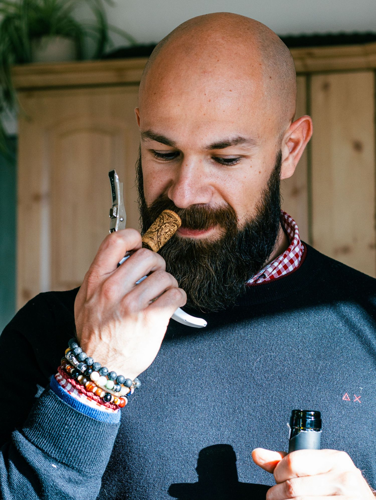 Person in a dark sweater taking bites of chocolate in a sequence of candid shots.