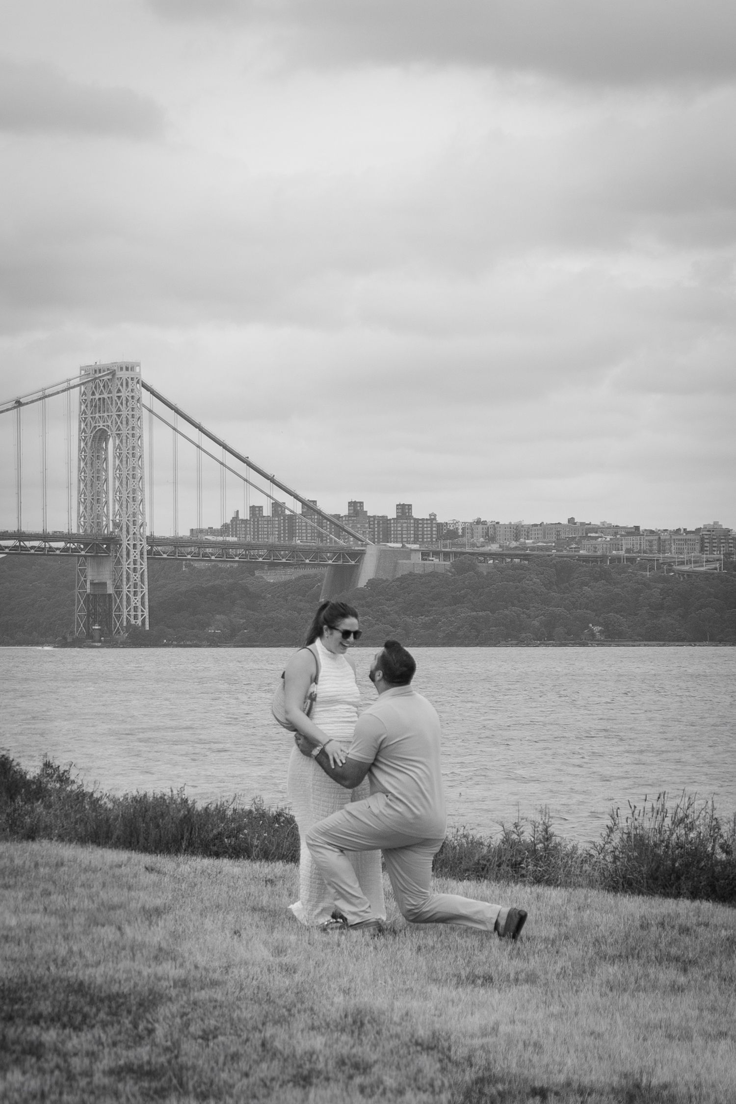 Black and white proposal photography of a couple in Edgewater, New Jersey.
