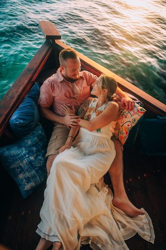 “Romantic couples photoshoot at Aruba Ocean Villas — intimate overwater villa session during sunset.”