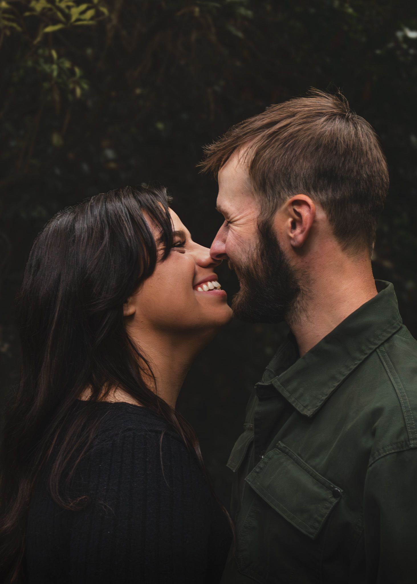 Engaged couple about to kiss in University of Washington park, in. Seattle
