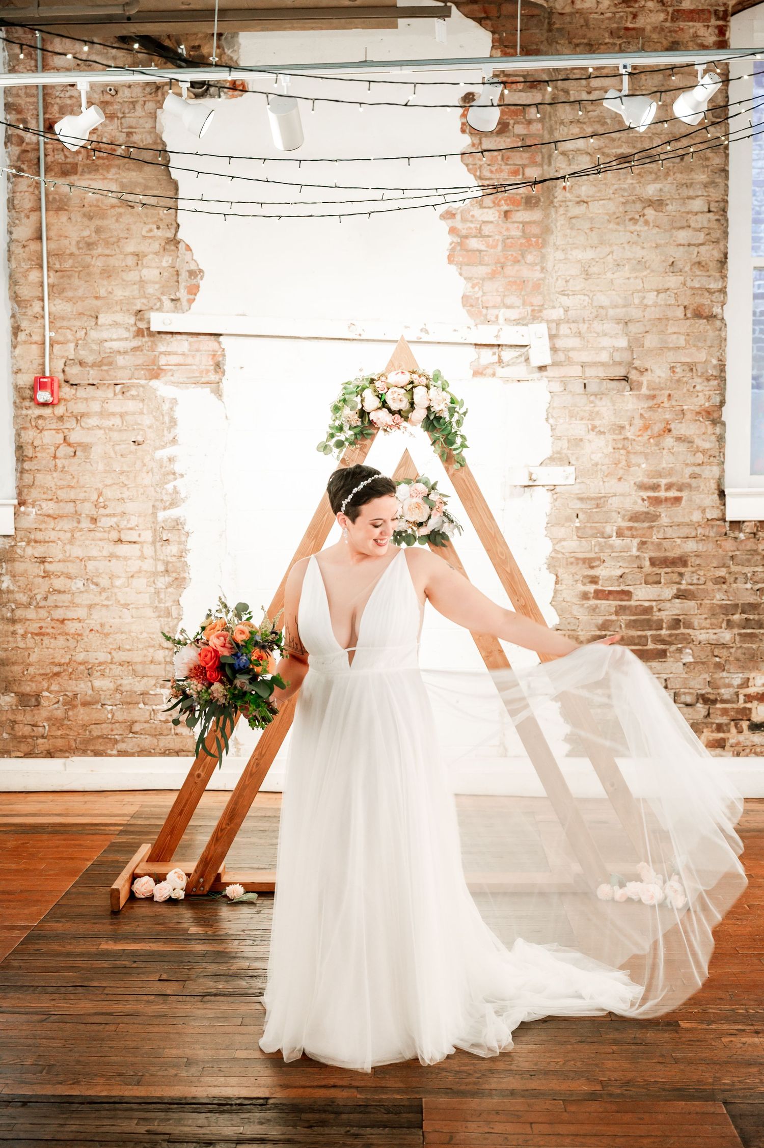 Wedding dress movements captured in sequence against exposed brick walls and string lights. Knoxville Wedding Photographer