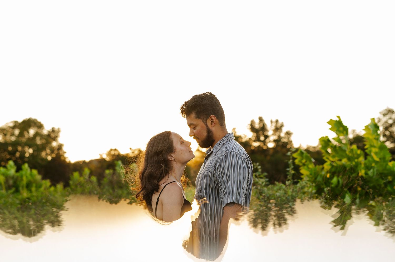Minimalist landscape portrait of a couple against a natural backdrop. Knoxville Couple Photographer