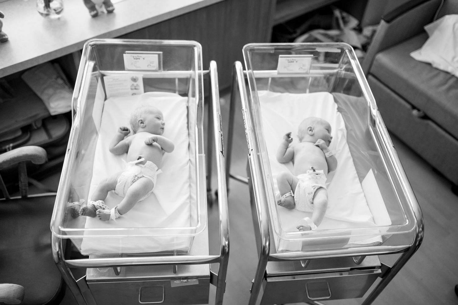 Multiple newborns resting in clear hospital bassinets viewed from above. Knoxville Newborn Photographer UT Medical Center
