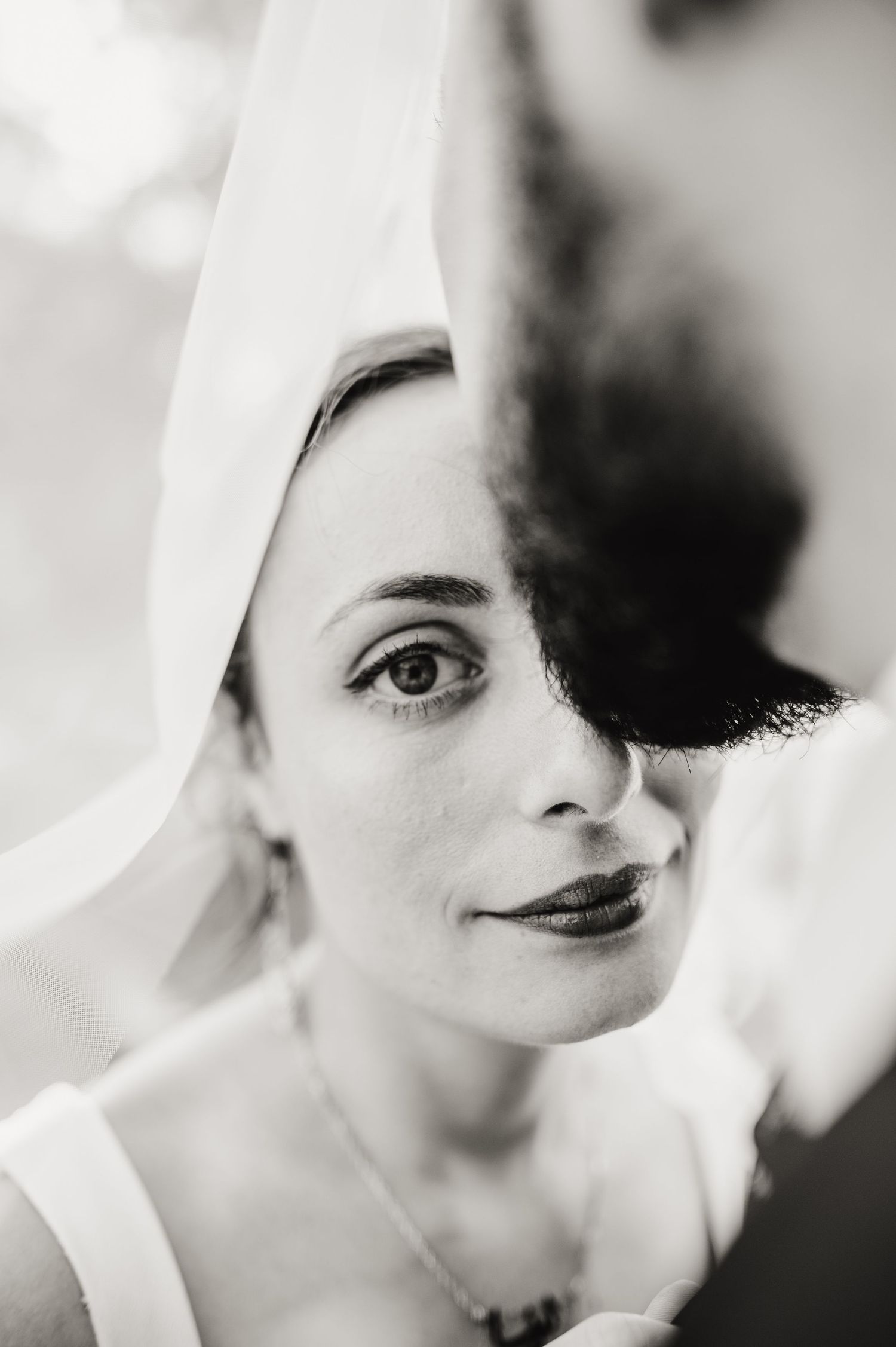 Artistic black and white close-up bridal portraits with soft lighting and veil details. Knoxville Wedding Photographer