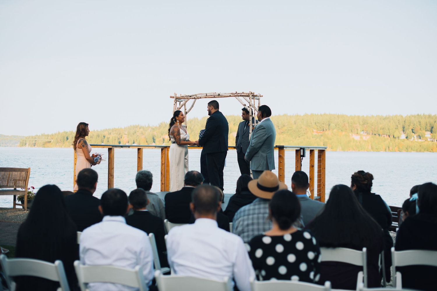 Wedding ceremony setup with white chairs facing a waterfront view. Knoxville Wedding Photographer