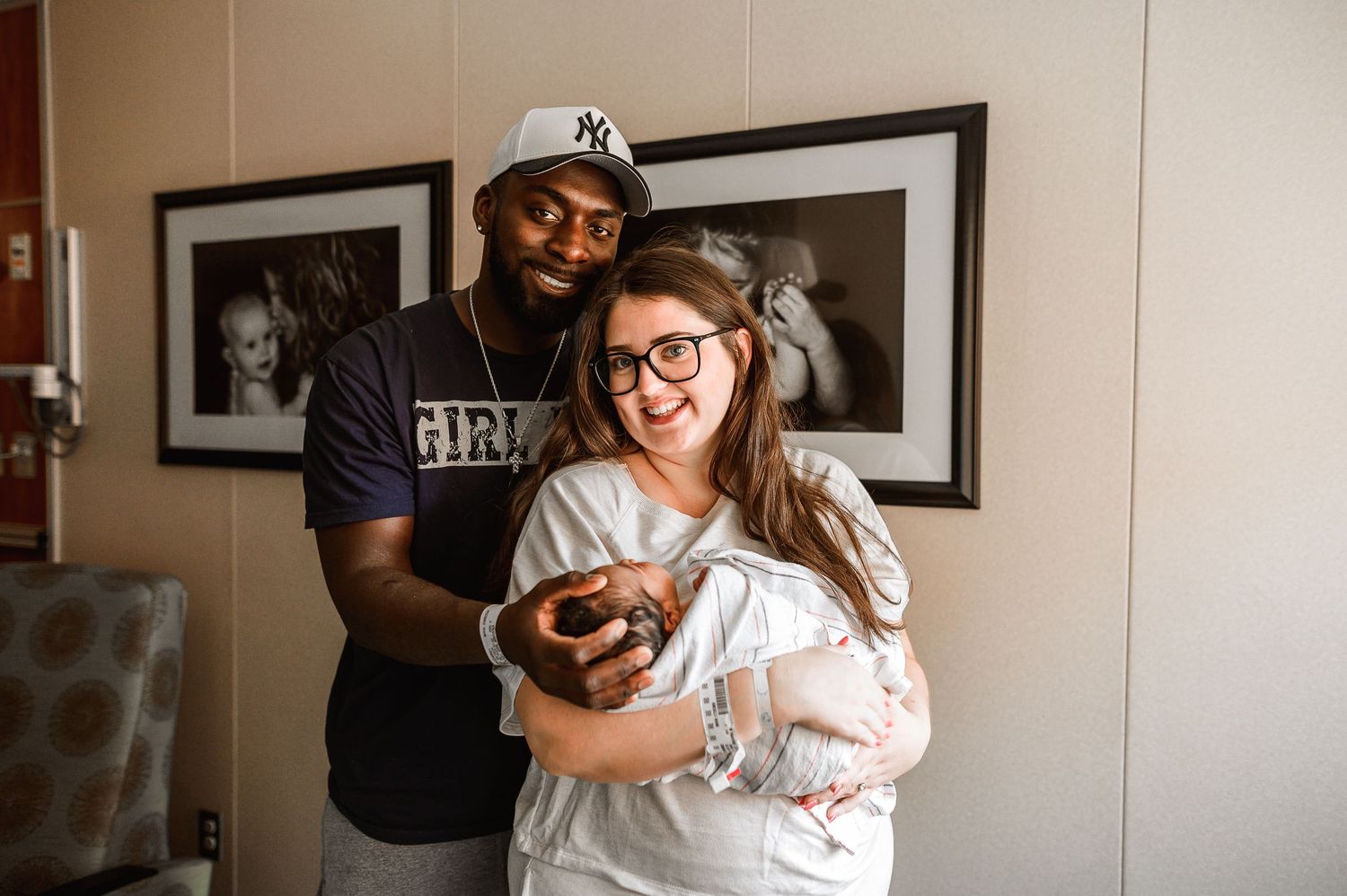 Hospital room scene with family gathered around newborn. Knoxville Newborn Photographer UT Medical Center