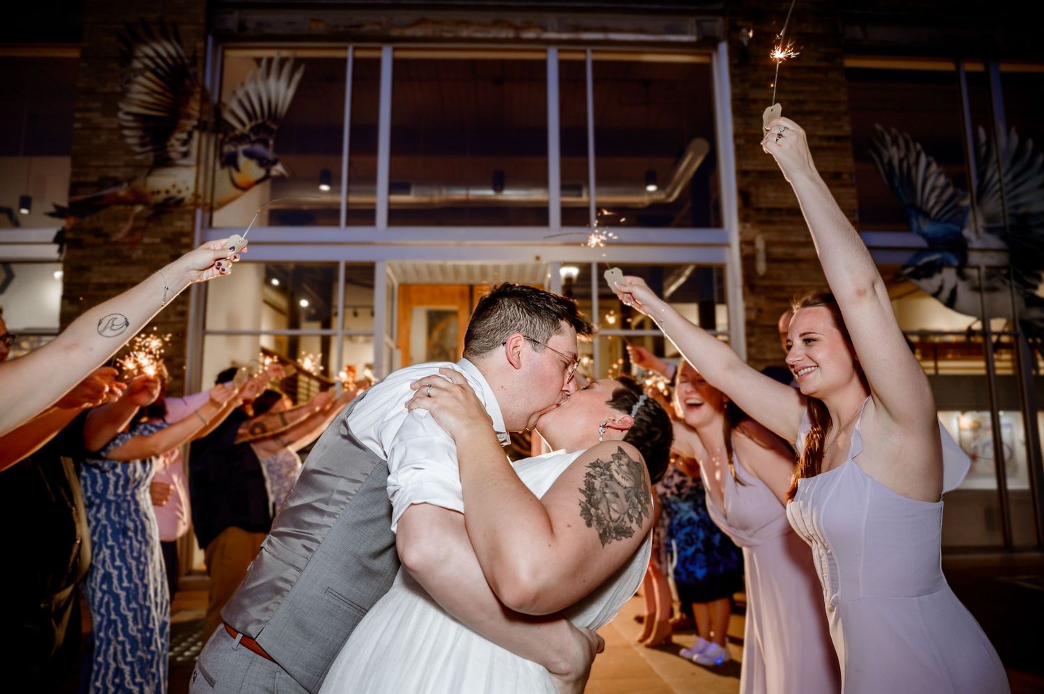 Guests dancing and raising their hands during a lively wedding reception celebration. Knoxville Wedding Photographer