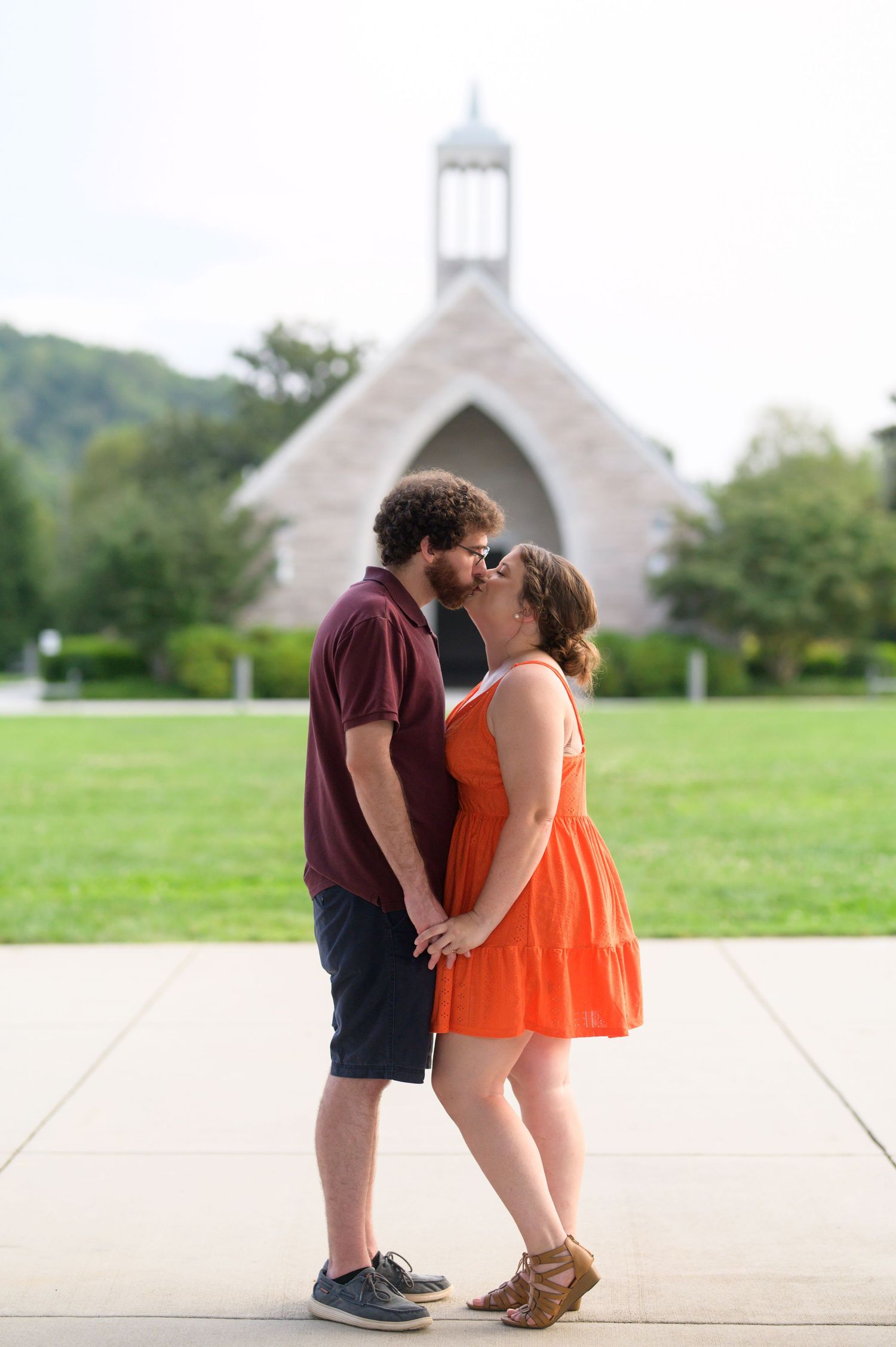 Sweet engagement photos taken in front of a white chapel on a sunny day. Knoxville Couple Photographer