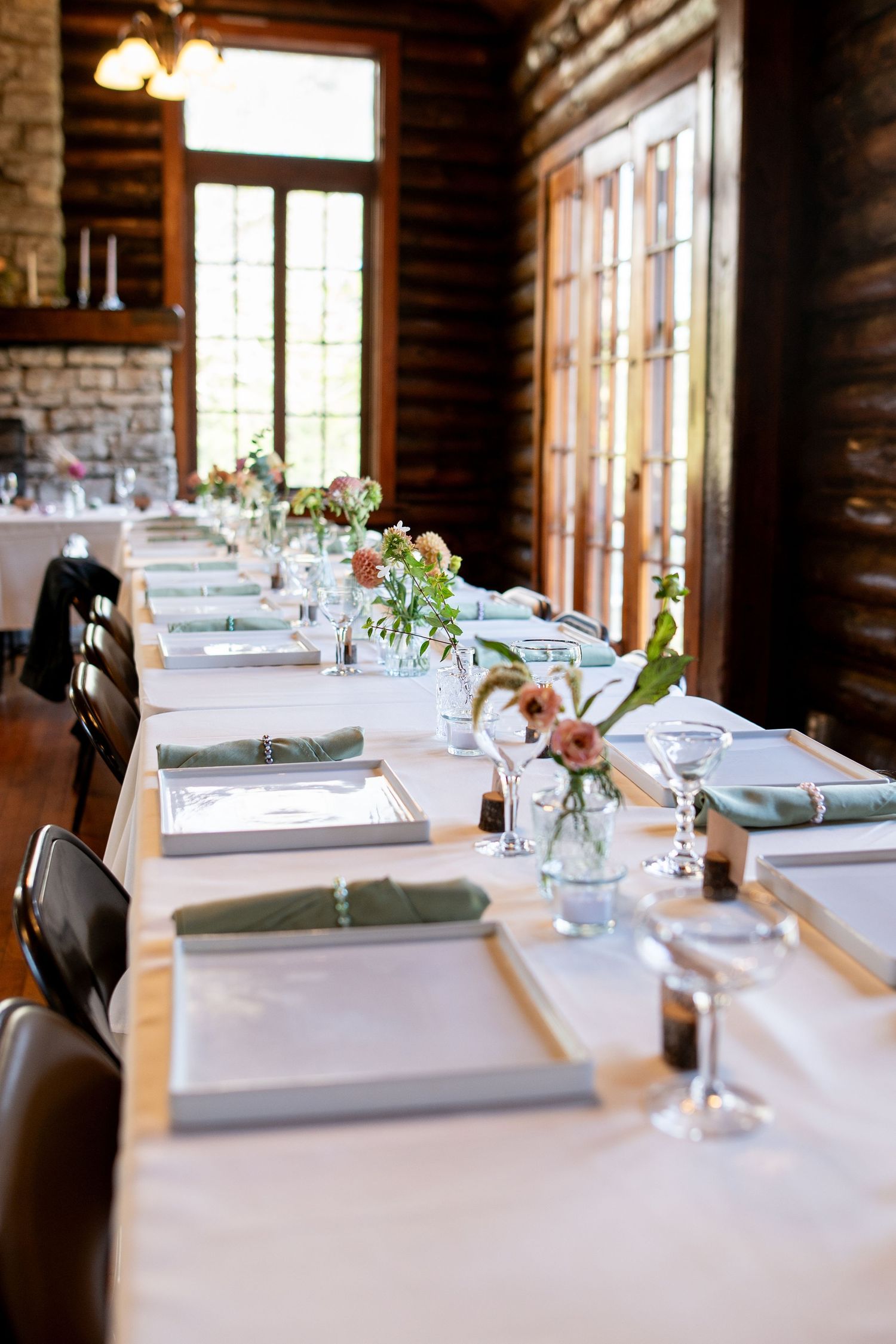 Elegant table settings in rustic log cabin venue with natural lighting. Knoxville Wedding Photographer. Norris State Park