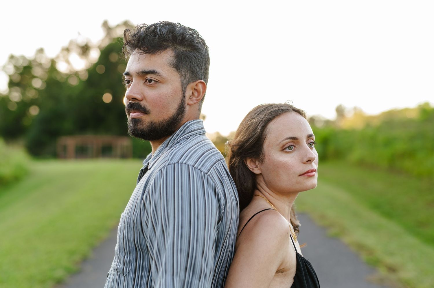 Artistic couple portrait on a country path during golden hour. Knoxville Couple Photographer. Melton Hills Park