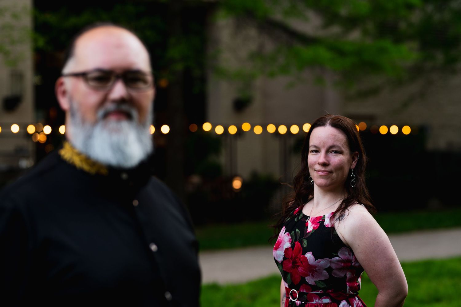A romantic outdoor portrait session with string lights creating a warm ambiance. Knoxville Couple Photographer. Market Square Knoxville
