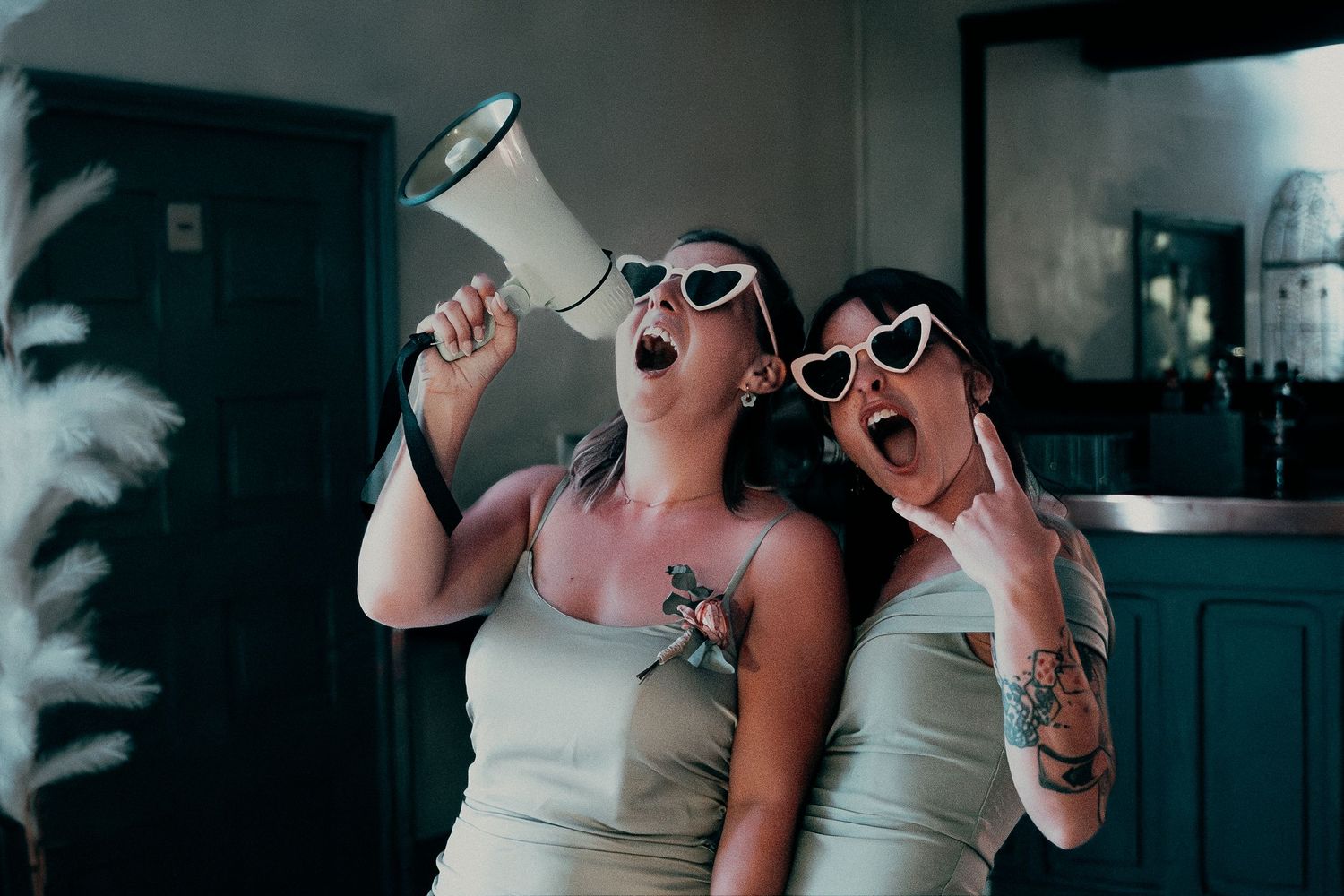 A series of black and white photos showing people laughing and expressing joy in candid moments.