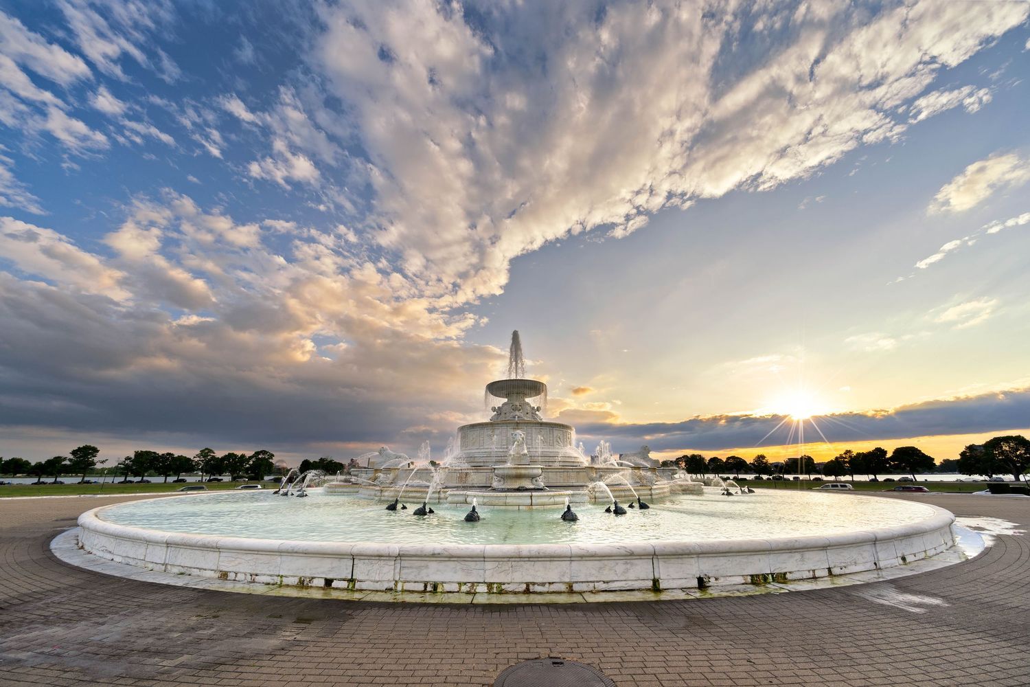 Panoramic view of the Scott Fountain on Belle Isle in Detroit under dramatic cloudy skies.