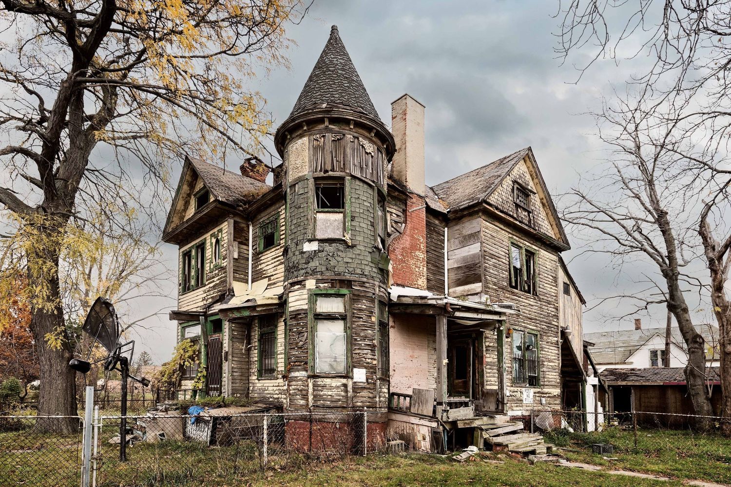 An abandoned historic castle-like home with distinctive architectural features in Detroit, Michigan.