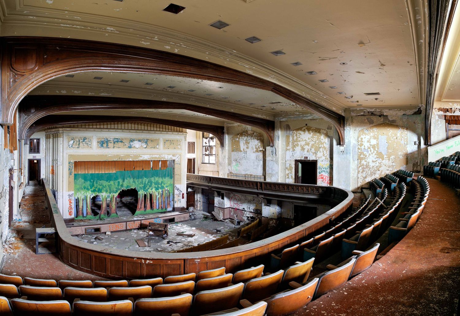 Abandoned Highland Park high school auditorium from the balcony shown in panoramic view in Detroit, Michigan.