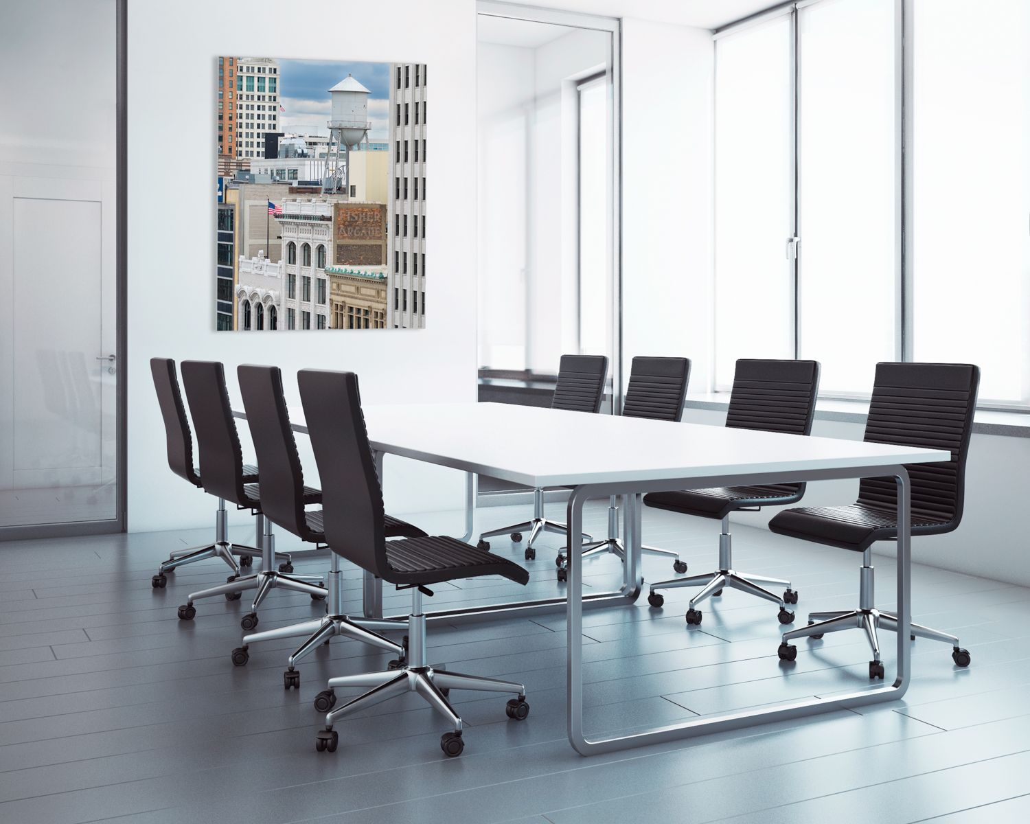 Sleek corporate conference room with modern office chairs and downtown Detroit, Michigan photo on the wall.
