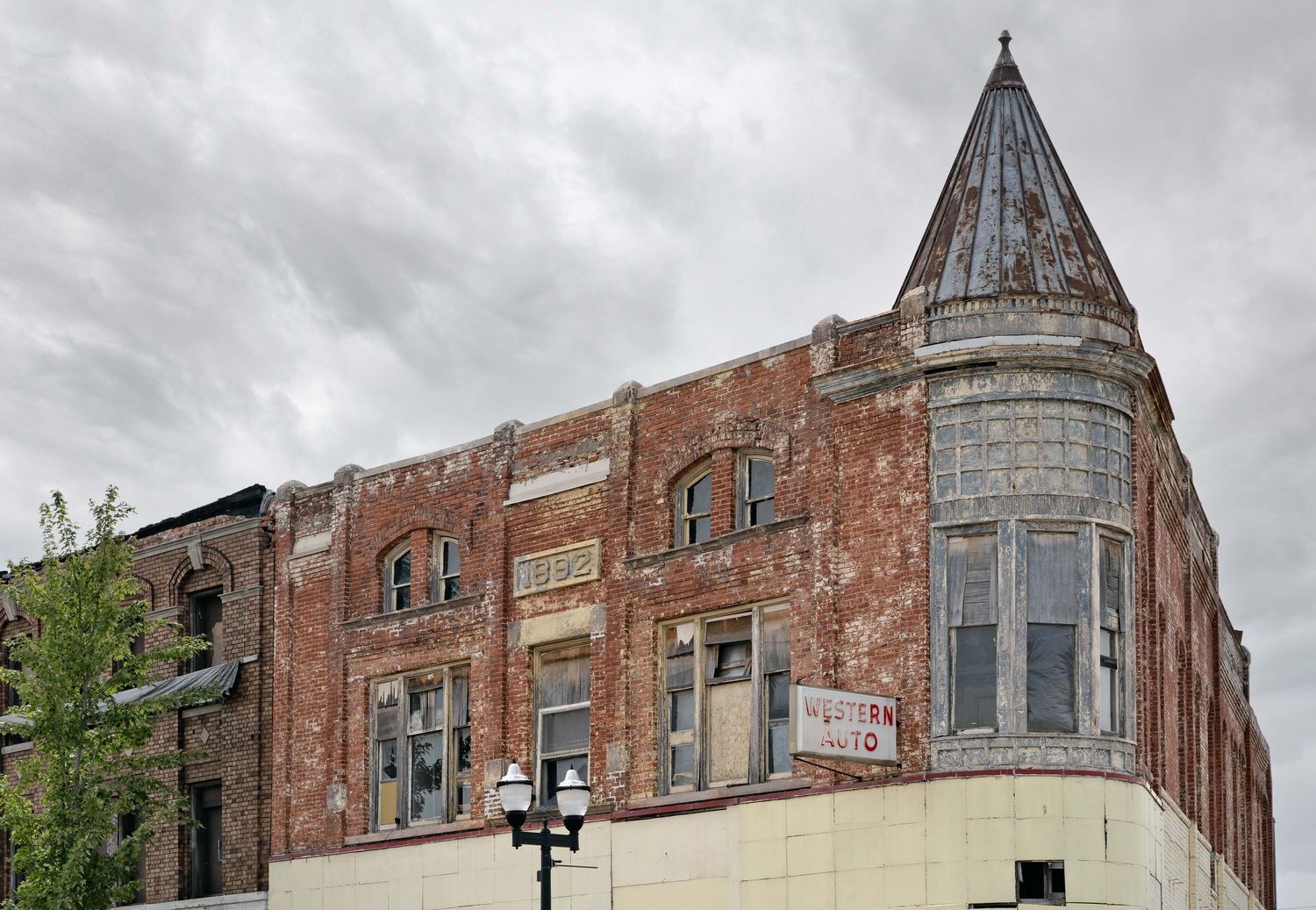 A historic 1892 brick building with Victorian architectural features in Saginaw, Michigan.