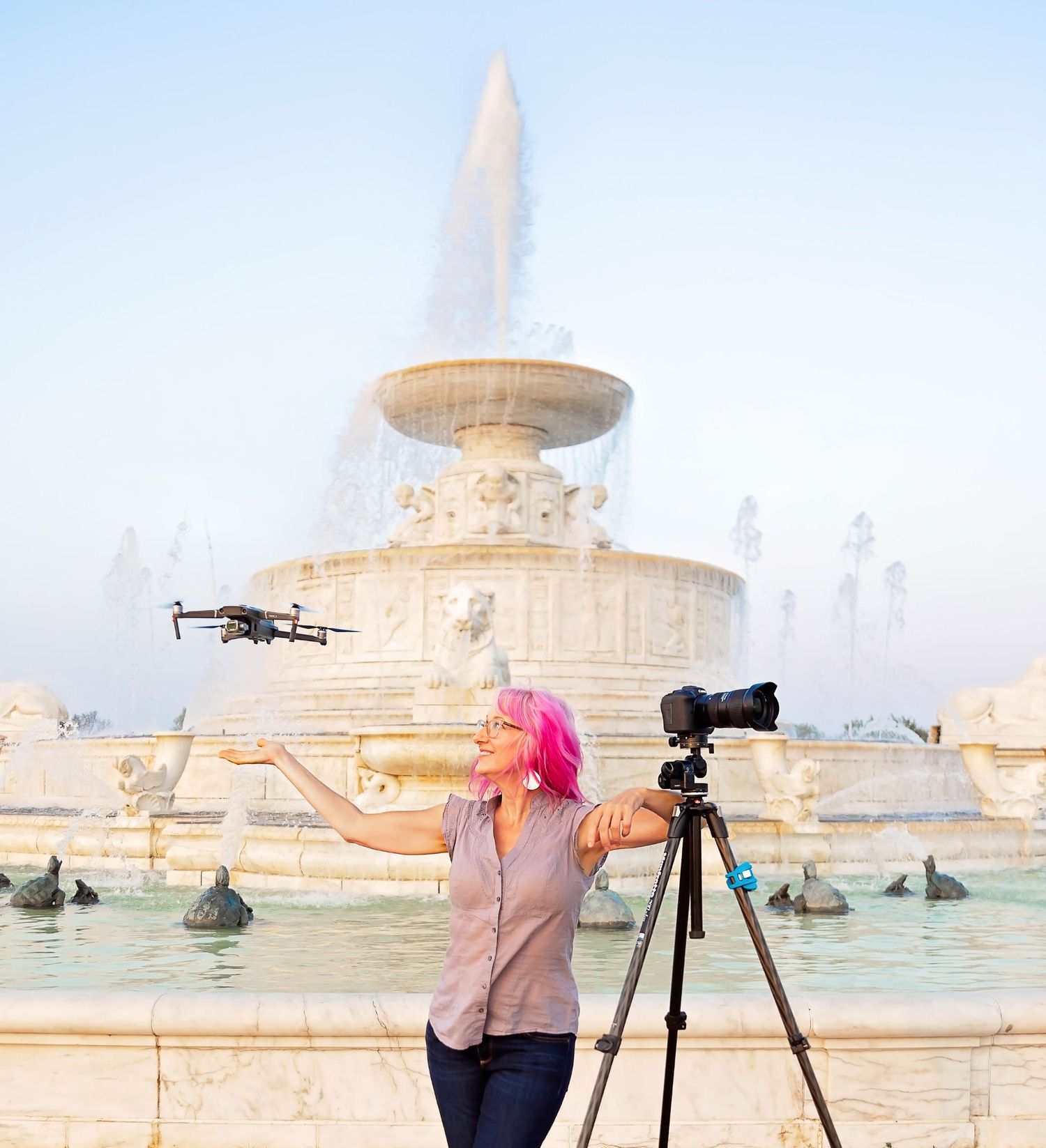 Professional camera equipment and drone in front of the Scott Fountain with Alanna St Laurent during golden hour in Detroit, Michigan.