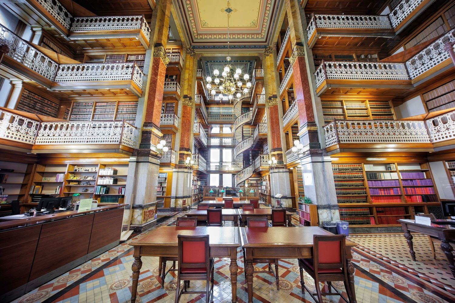 Iowa State Capitol Law library with intricate architectural details and several levels with table and chairs in Des Moines, Iowa.