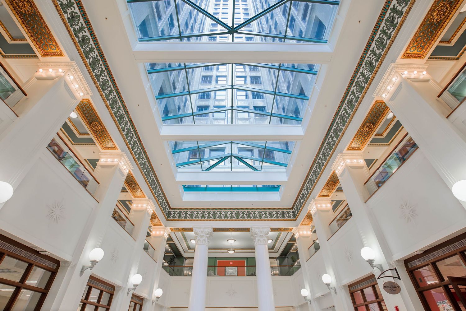 Chrysler House atrium ceiling with geometric skylight and ornate columns in Detroit, Michigan.