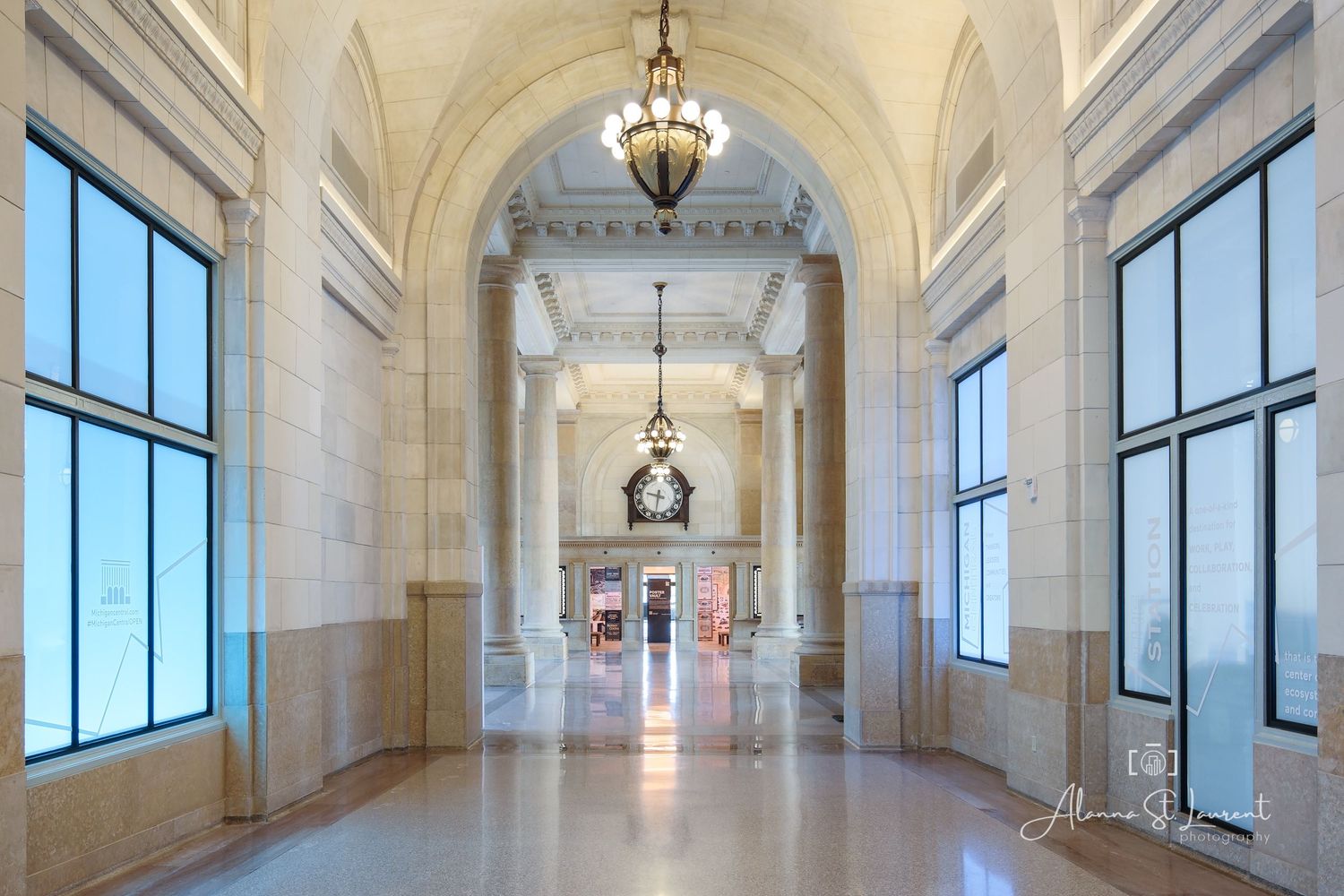 Bright corridor with arched ceilings and chandelier inside the renovated Michigan Train Station in Detroit, Michigan.
