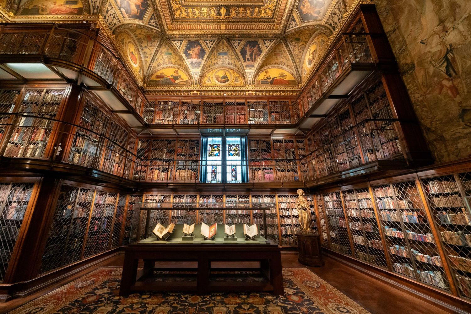 Manhattan J Pierpont Morgan ornate wood-paneled library interior with vaulted ceiling and decorative details captured in panoramic view.