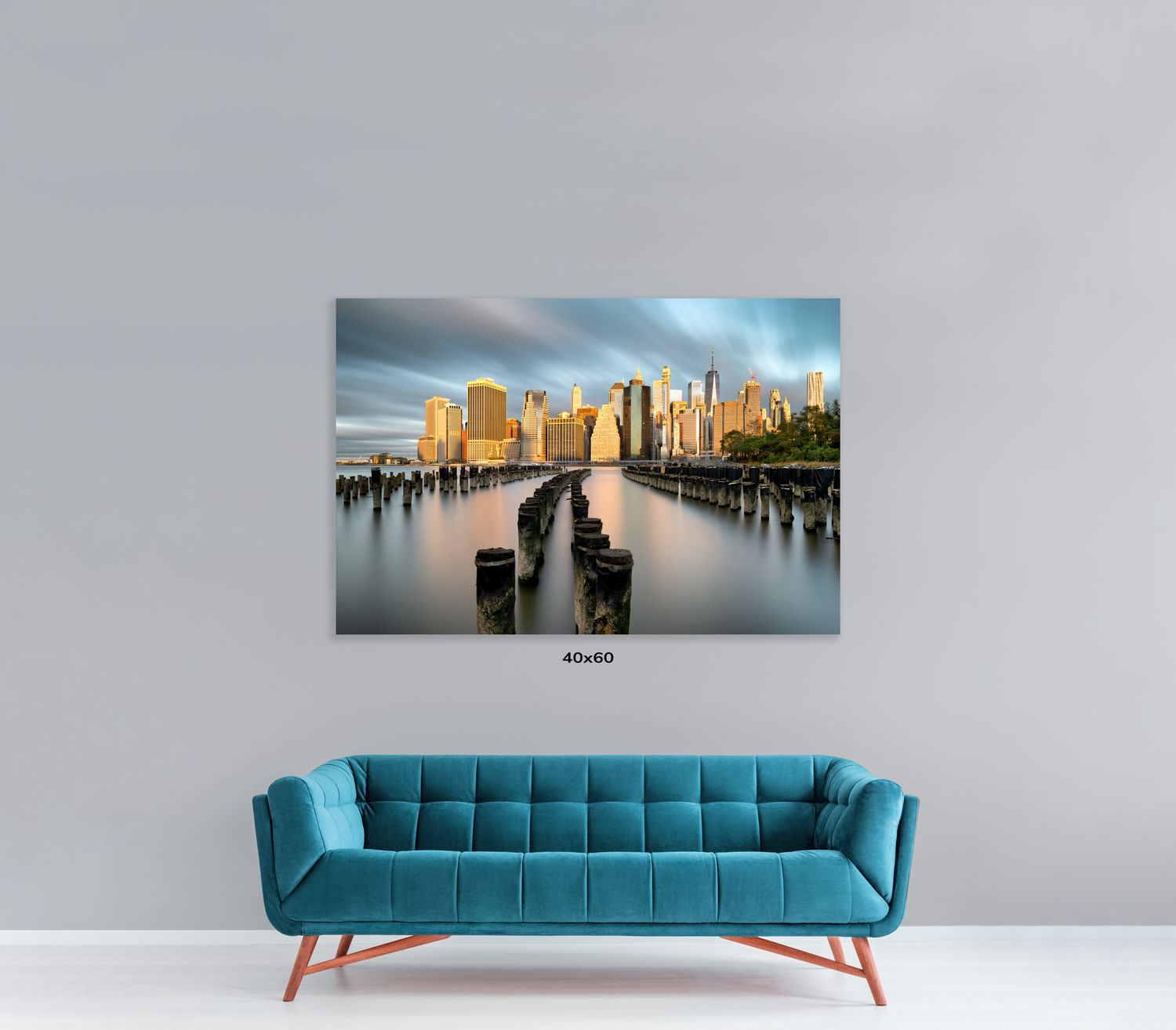 Designer blue couch with channel-tufted backrest displayed with urban photography wall art.