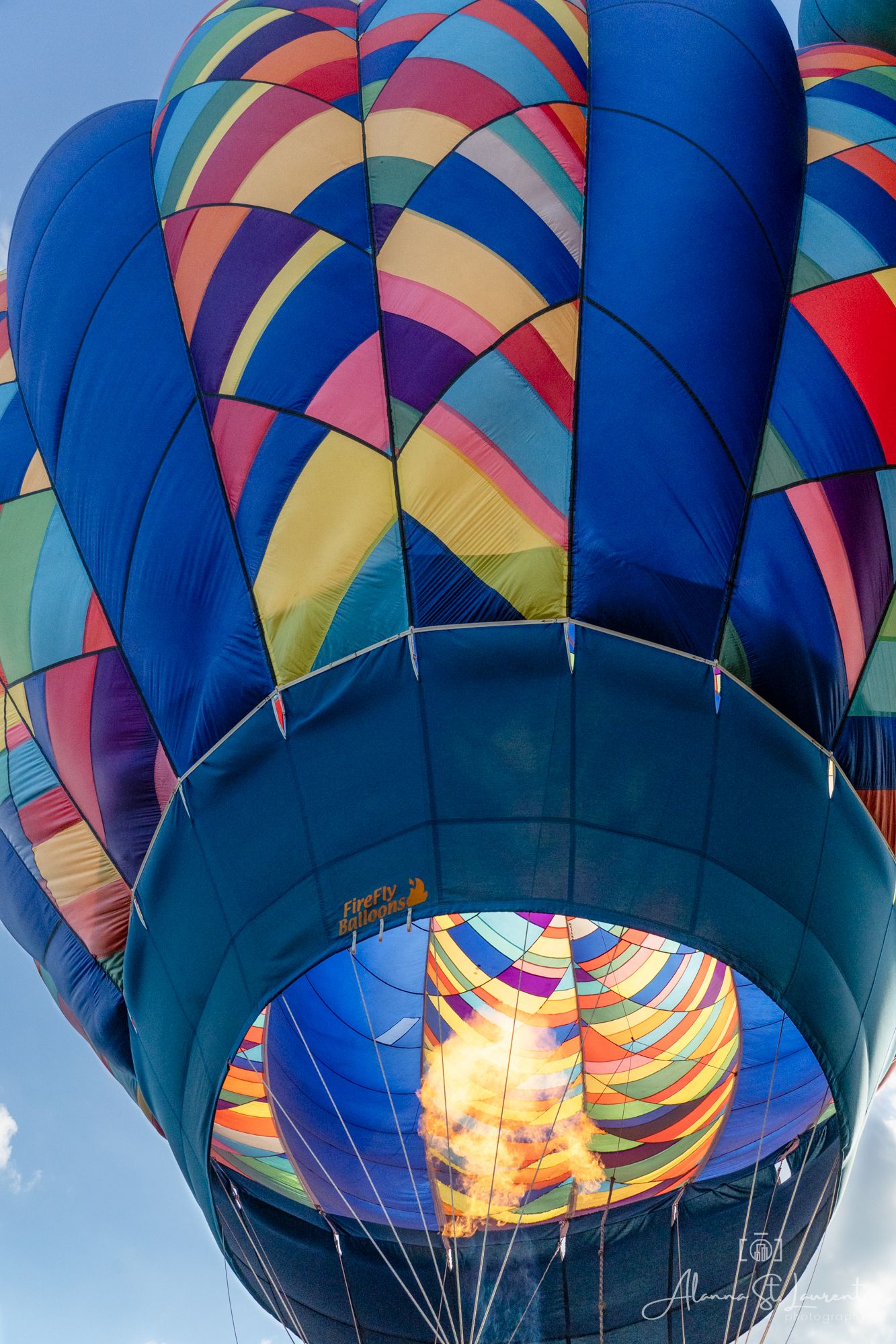 Close-up view of illuminated hot air balloon burners and orange flames during the Metamora Hot Air Balloon festival in Metamora, Michigan.