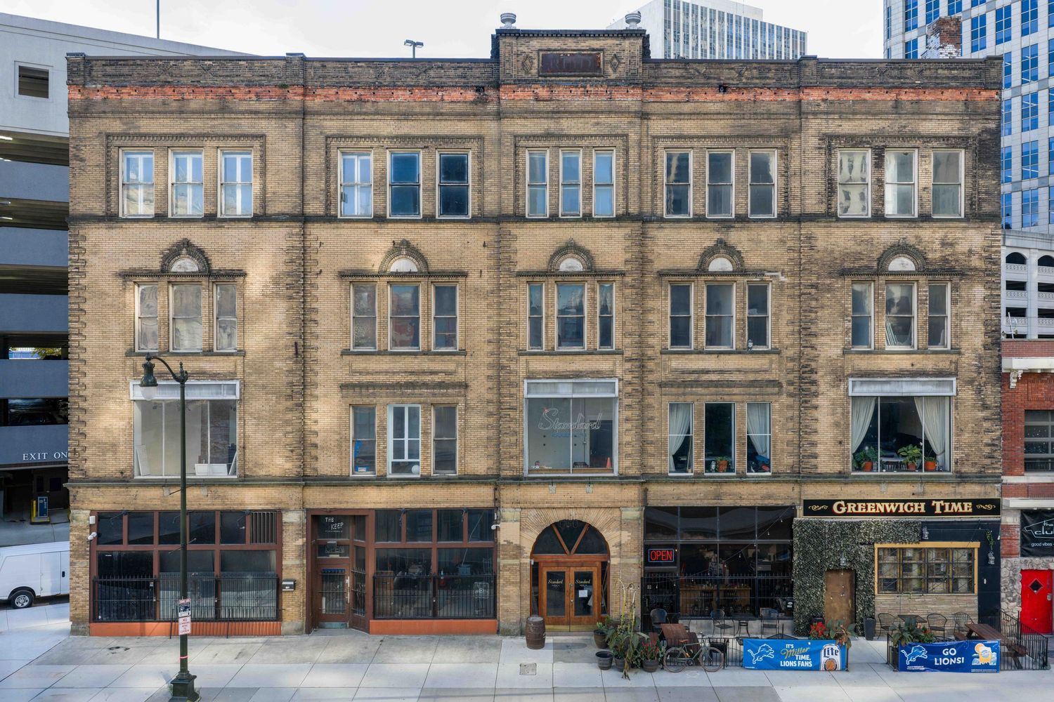 The historic Reid building facade with arched windows and ornate architectural details in downtown Detroit Michigan.
