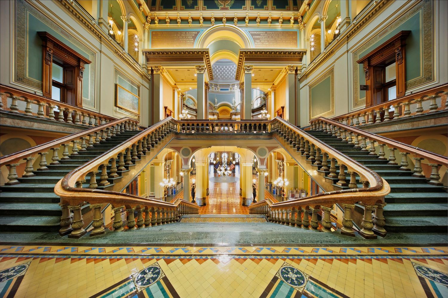 A grand staircase and gilded architectural details inside the Iowa Capitol building in Des Moines, Iowa.