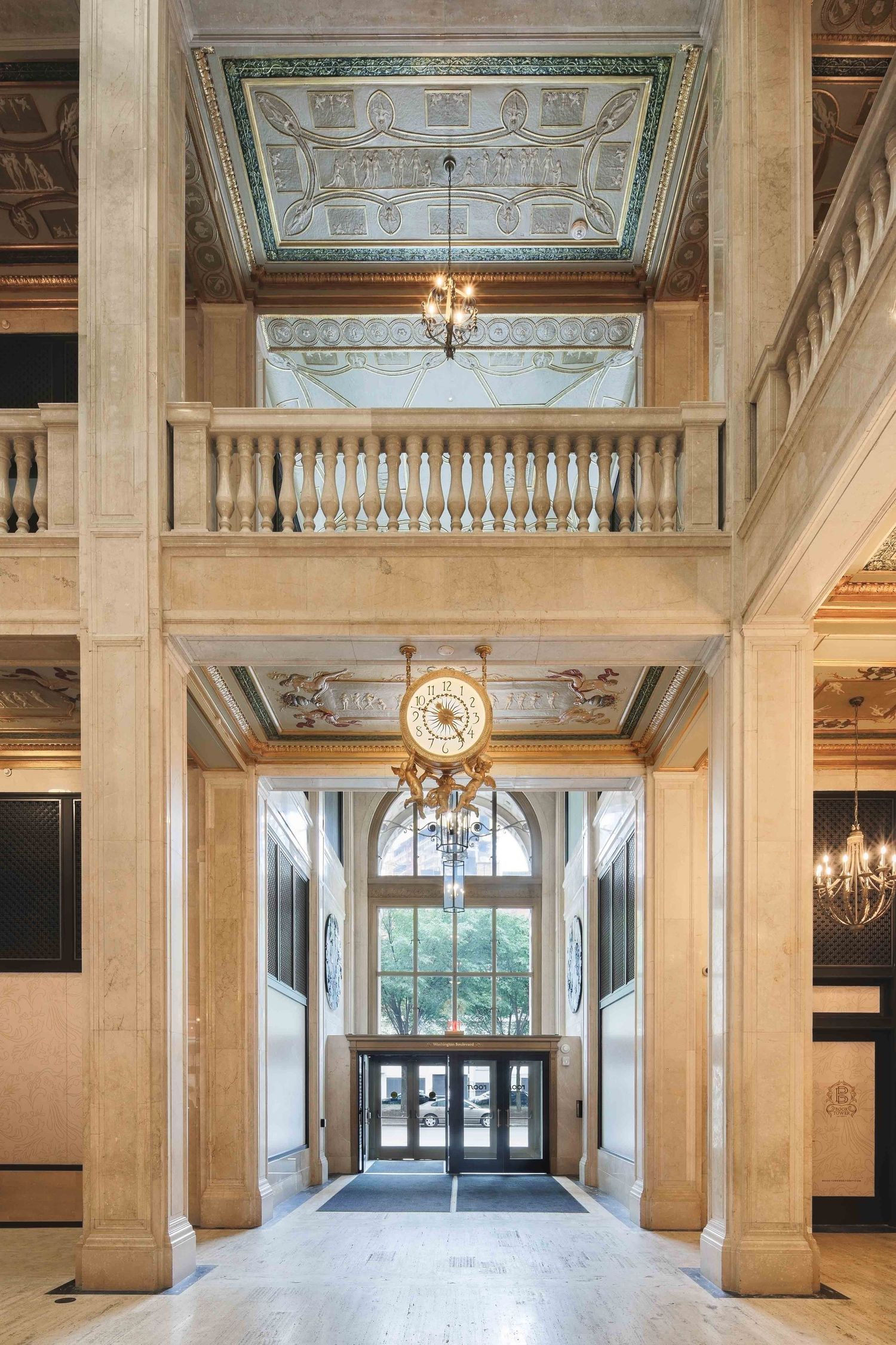 Majestic marble lobby with decorative ceiling, chandeliers and classical architectural details in the Book Tower lobby in downtown Detroit.