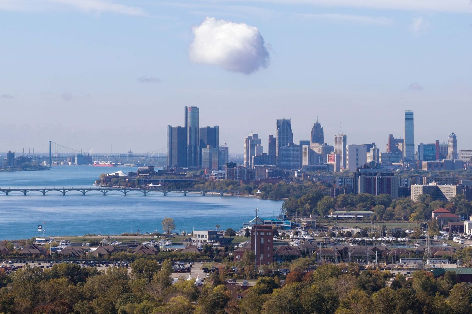 Skyline view of Detroit with the Mackenzie bridge and Detroit River and downtown visible on the horizon captured with Mavic 4 Pro drone.