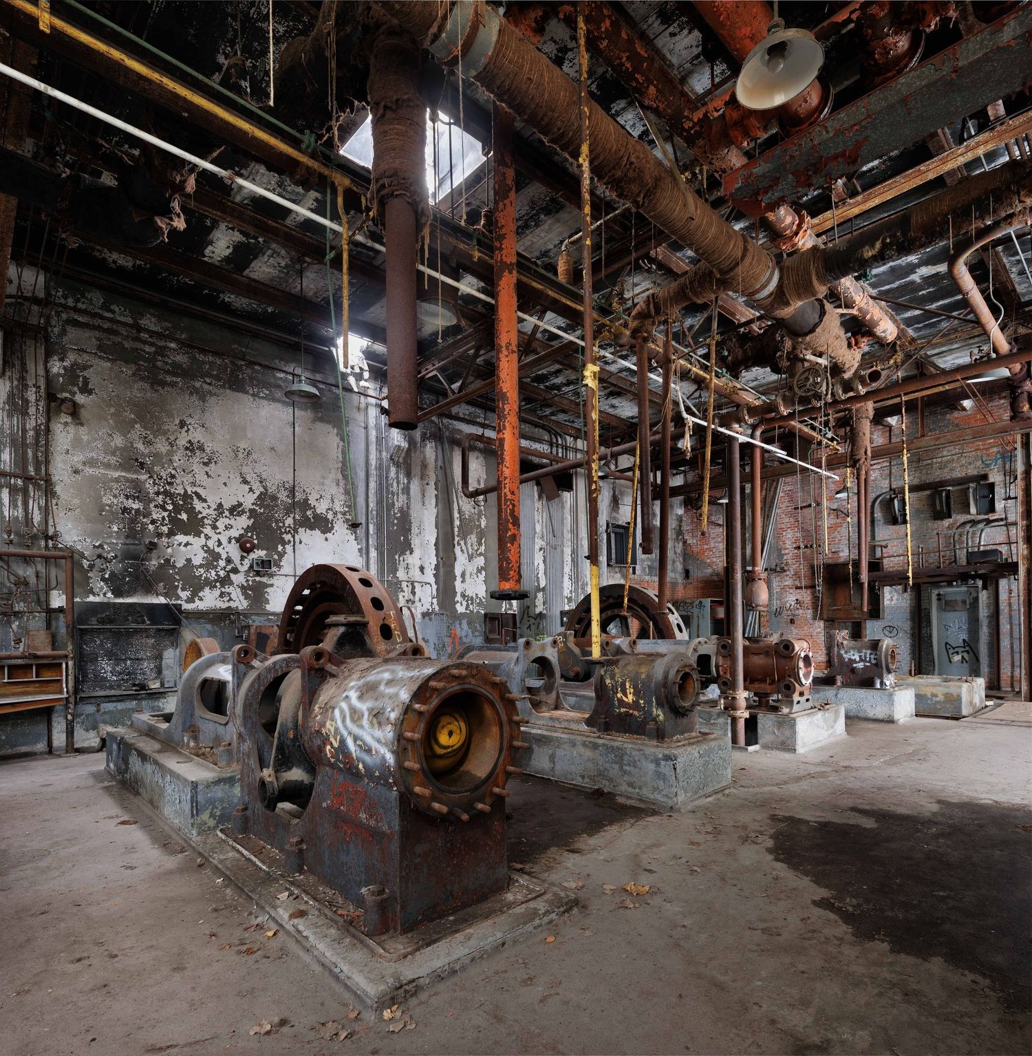 Abandoned Marine Terminal cold storage warehouse machine room vertical panorama in Detroit, Michigan.