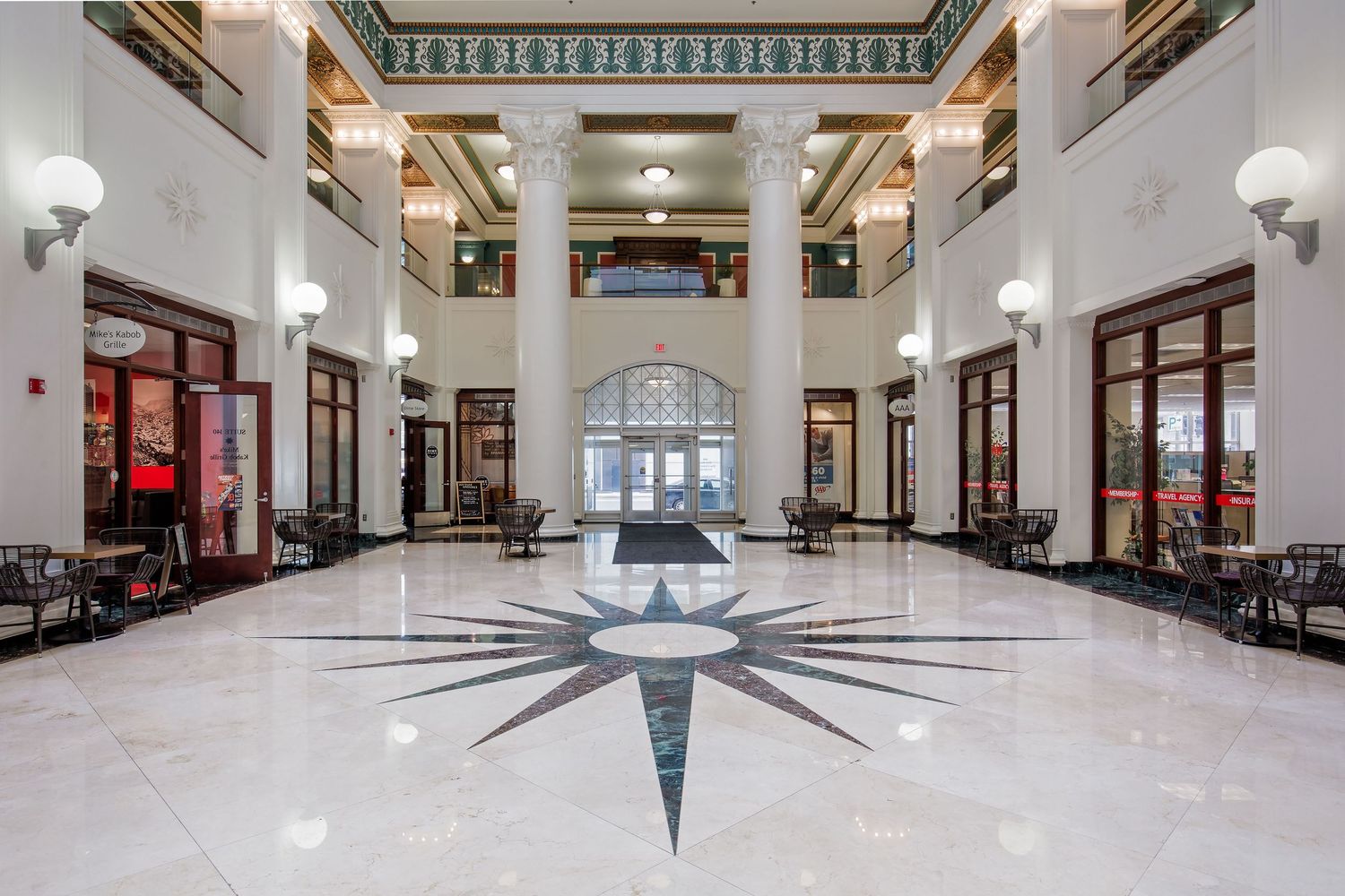 Grand marble lobby with ornate columns and star pattern floor of the Chrysler House in Detroit, Michigan.