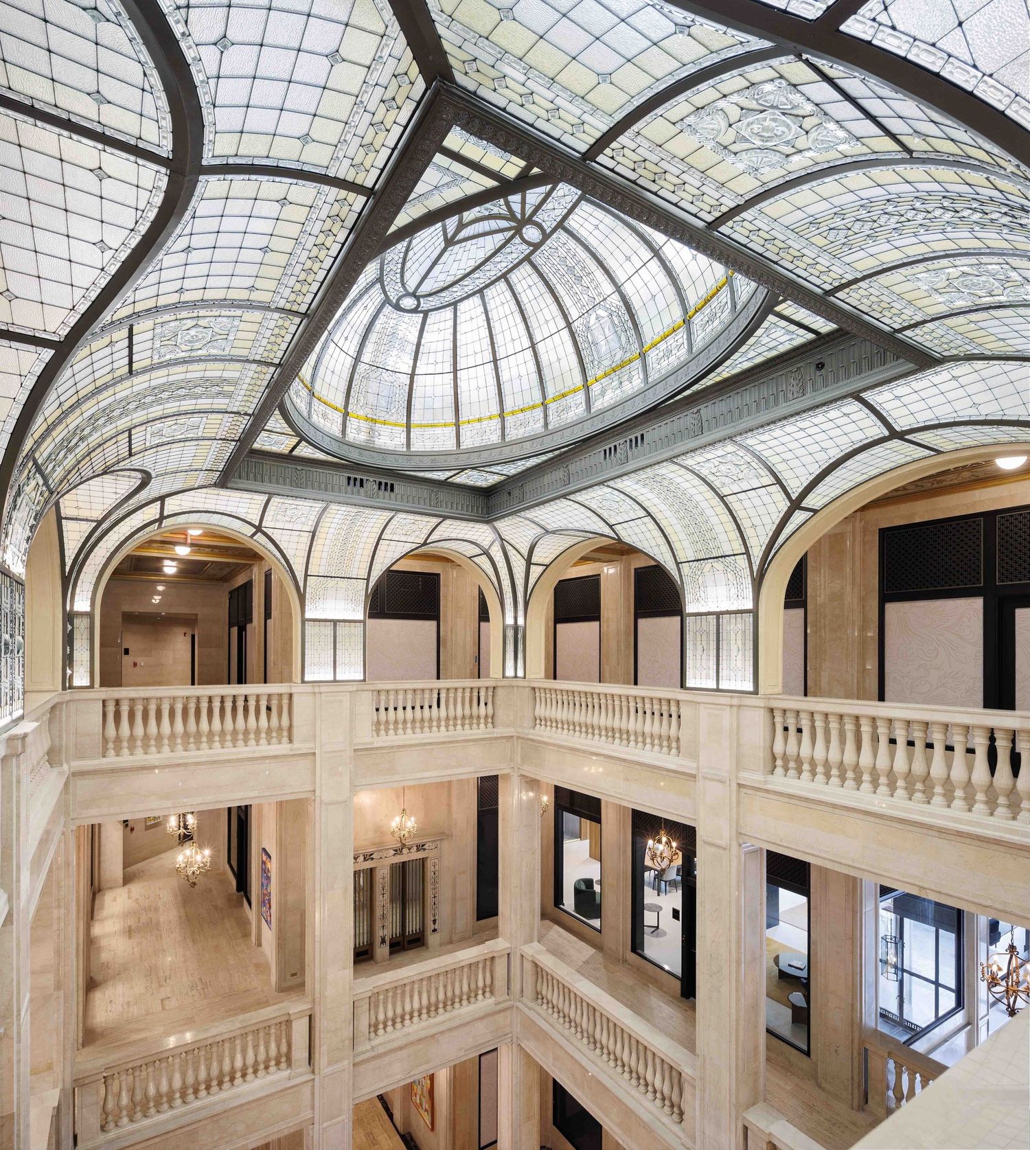 Elegant marble featuring a domed glass ceiling and classical columns on the third floor of the Book Tower in downtown Detroit, Michigan.