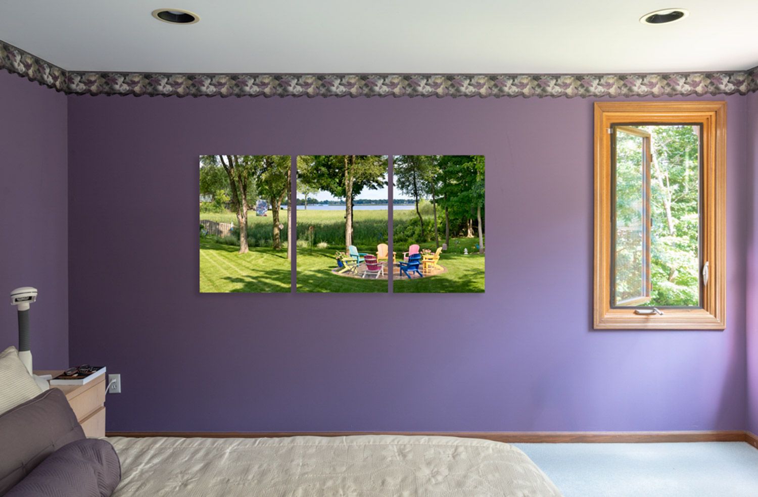 Interior bedroom with purple walls, recessed lighting, and decorative crown molding displaying landscape photo on the wall.