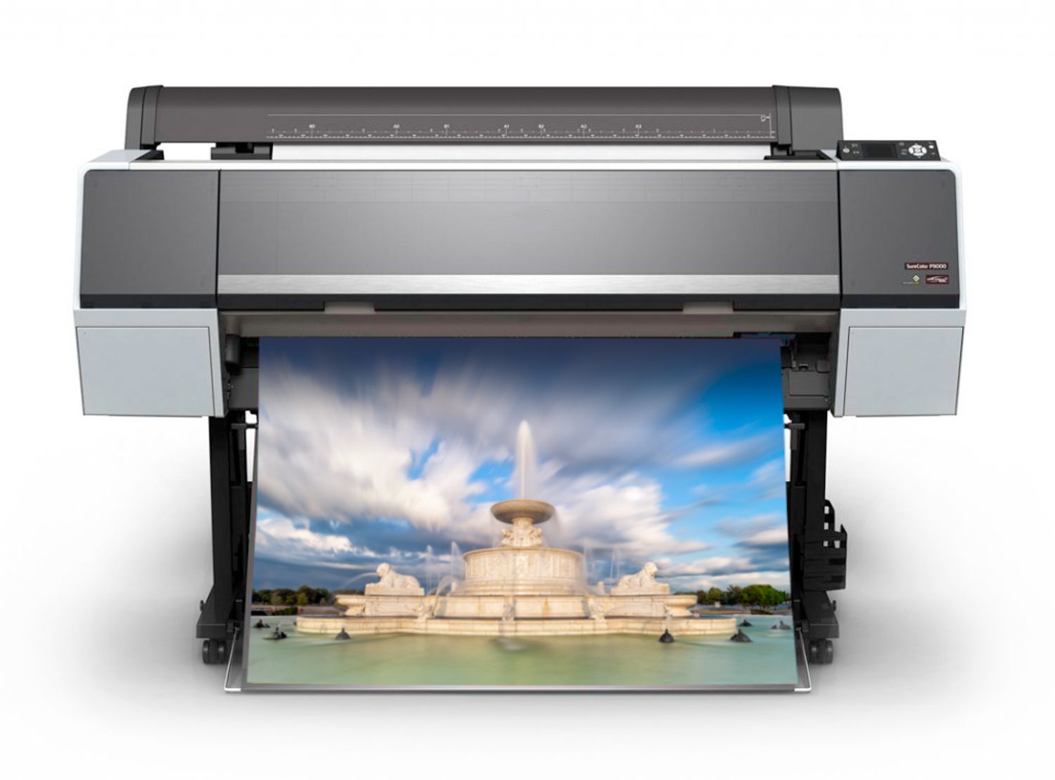 A large format professional photo printer displaying a landscape image.