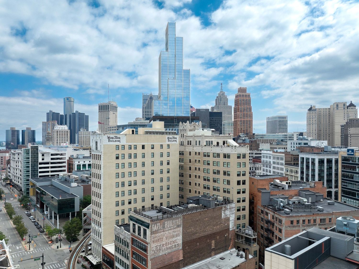 Panoramic cityscape view of downtown Minneapolis skyline with modern buildings under cloudy skies.