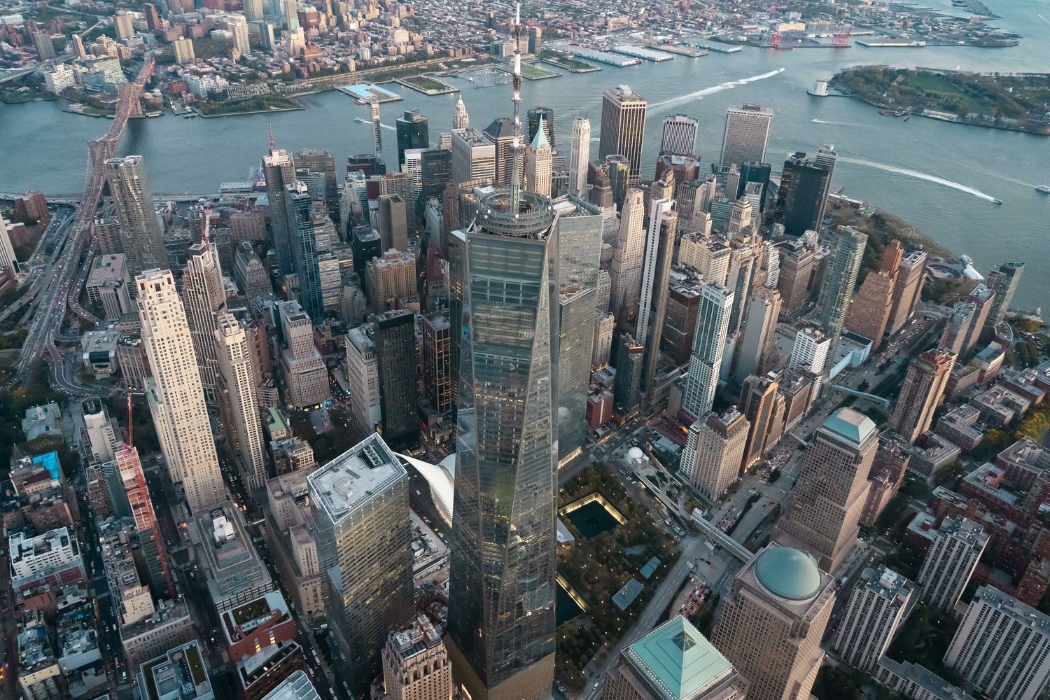 Aerial view of Manhattan skyline showing dense urban development and waterfront from a helicopter.