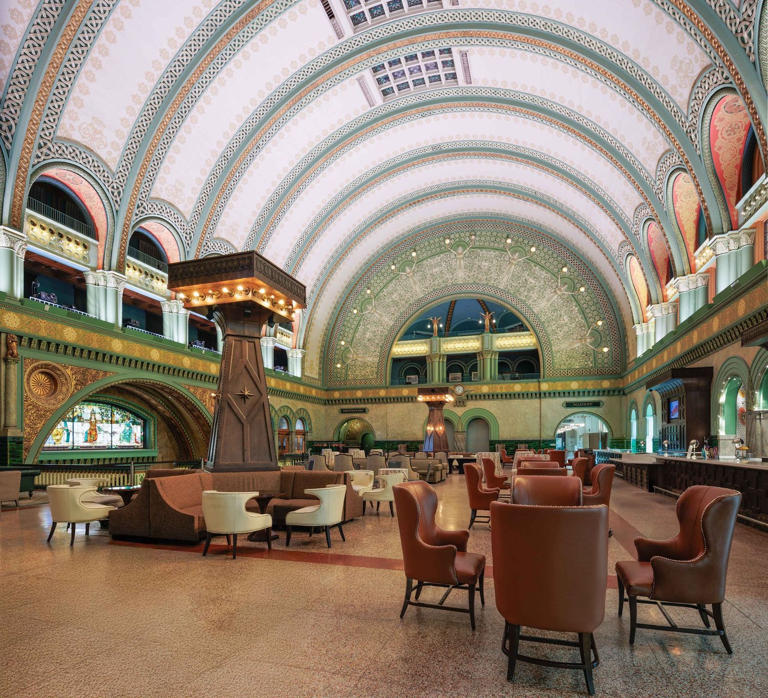 Historic Union Station restaurant with curved vaulted ceiling and vintage leather furniture in St Louis, Missouri.