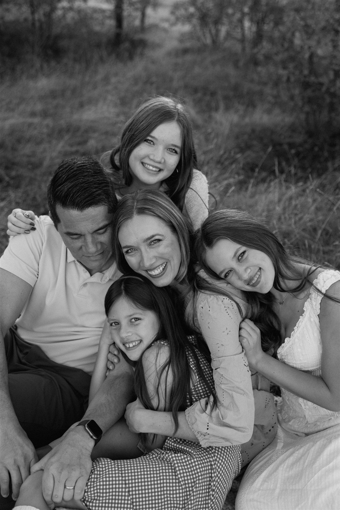 Family enjoying a portrait session outdoors in Redding, California, captured by Makayla Miranda Photo..