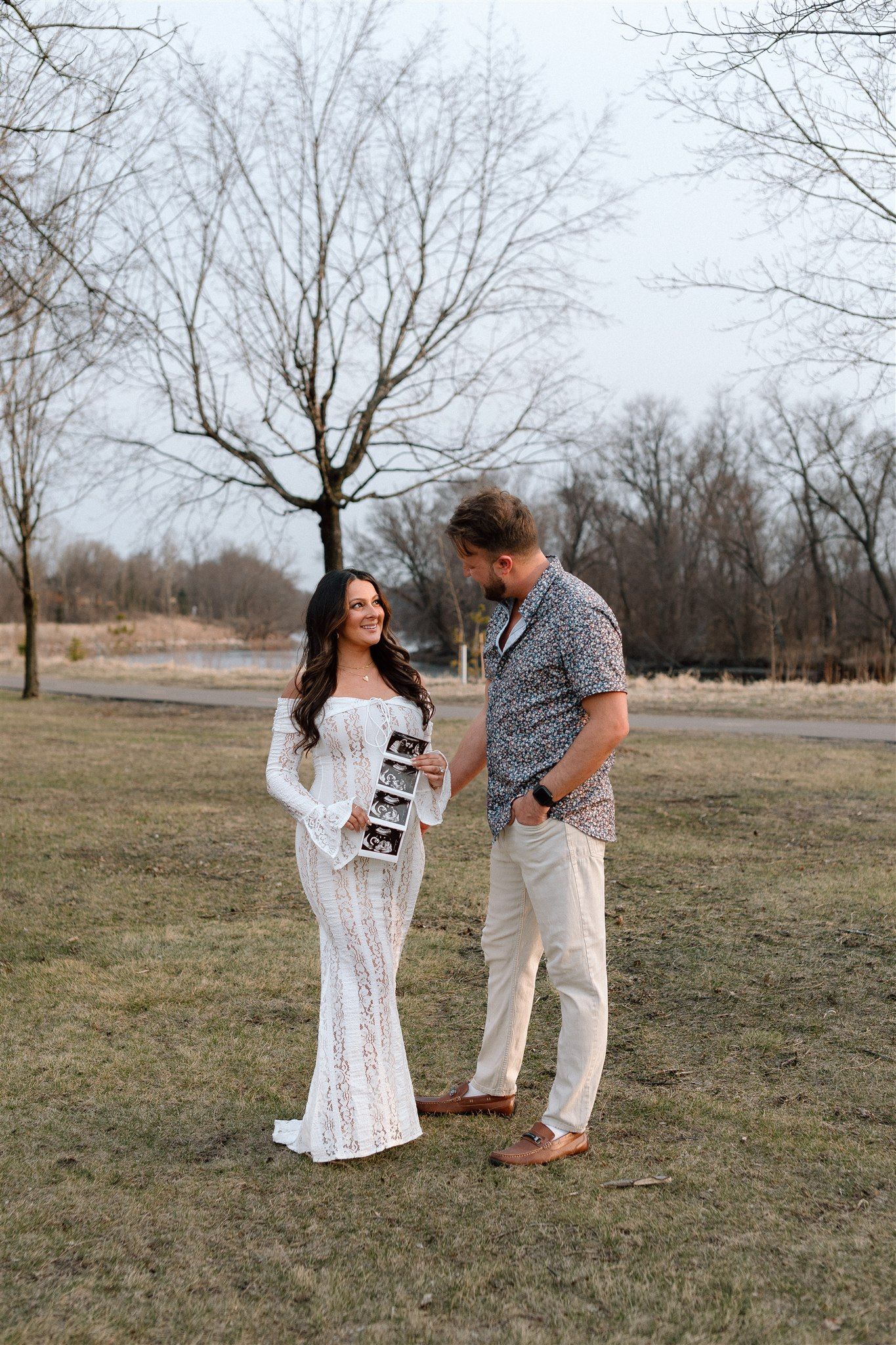 Expecting couple during a maternity session along the Mississippi River in Minnesota, captured by Makayla Miranda Photo.