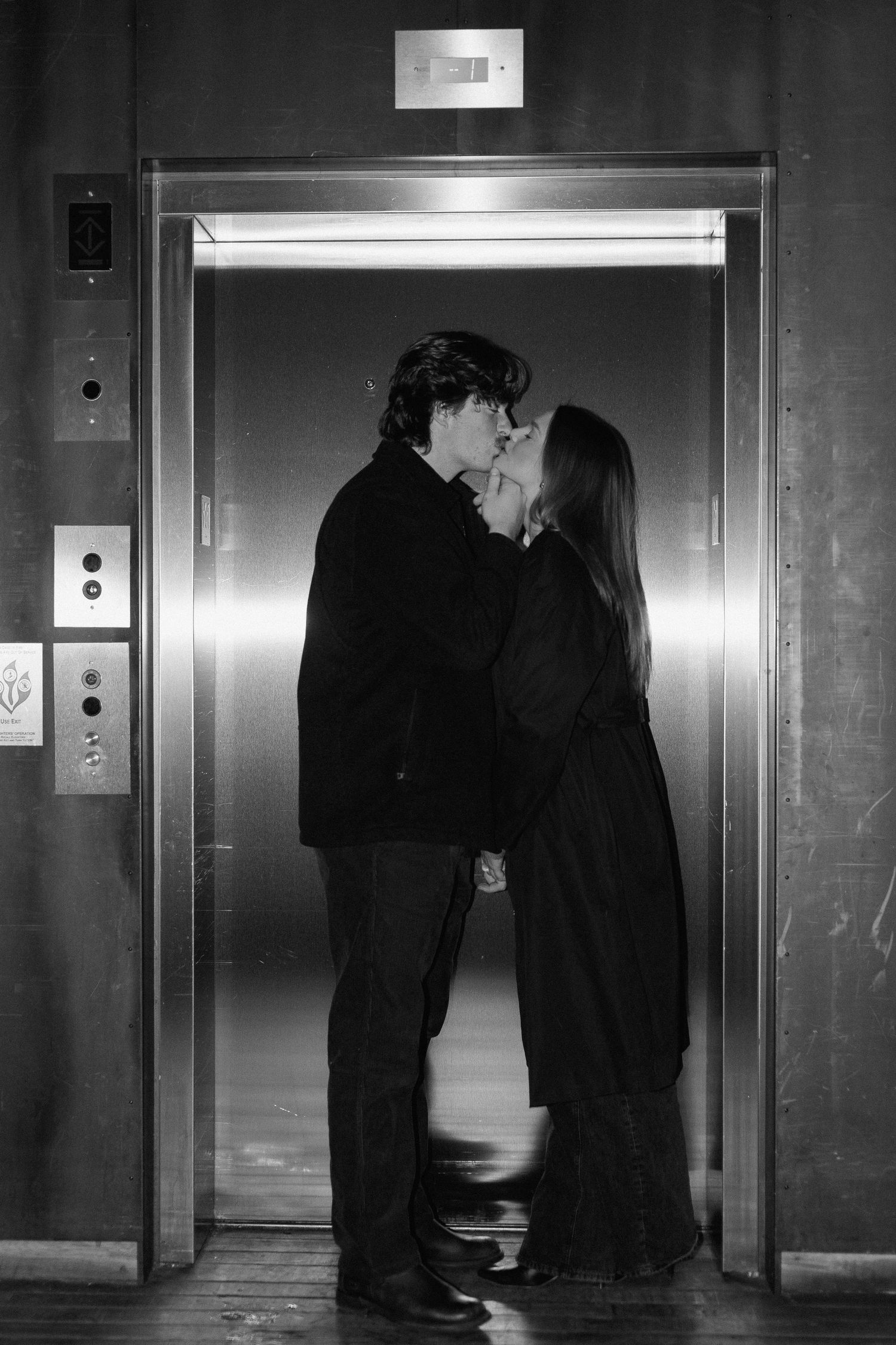 Couples session in elevator in Minneapolis, Minnesota. Captured by Makayla Miranda Photo.