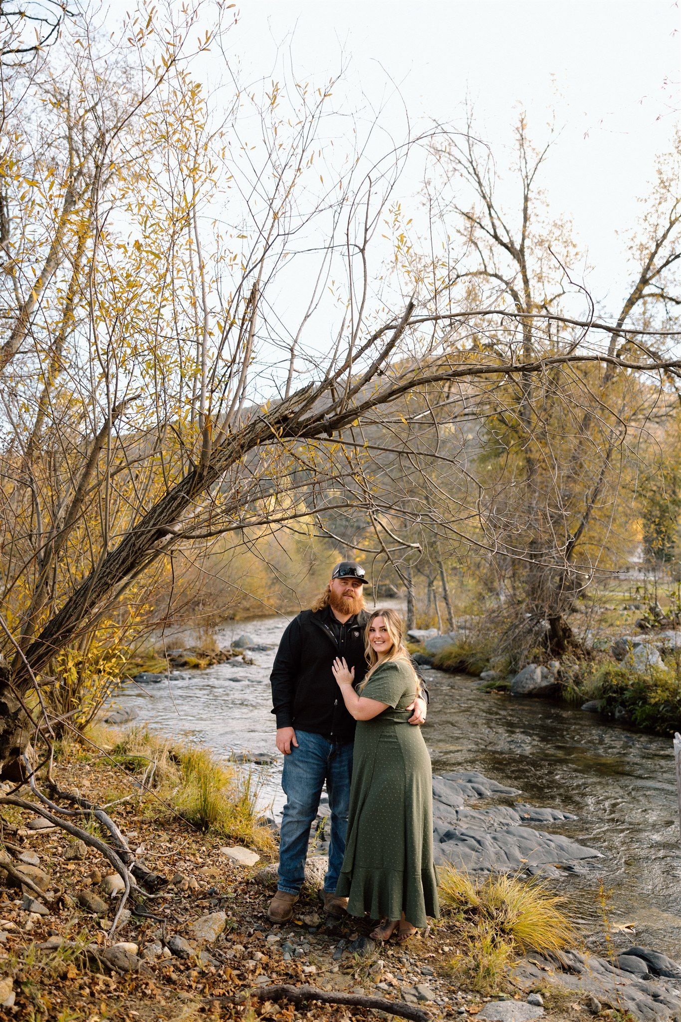 Couple enjoying their engagement session at Whiskeytown in Northern California, captured by Makayla Miranda Photo.