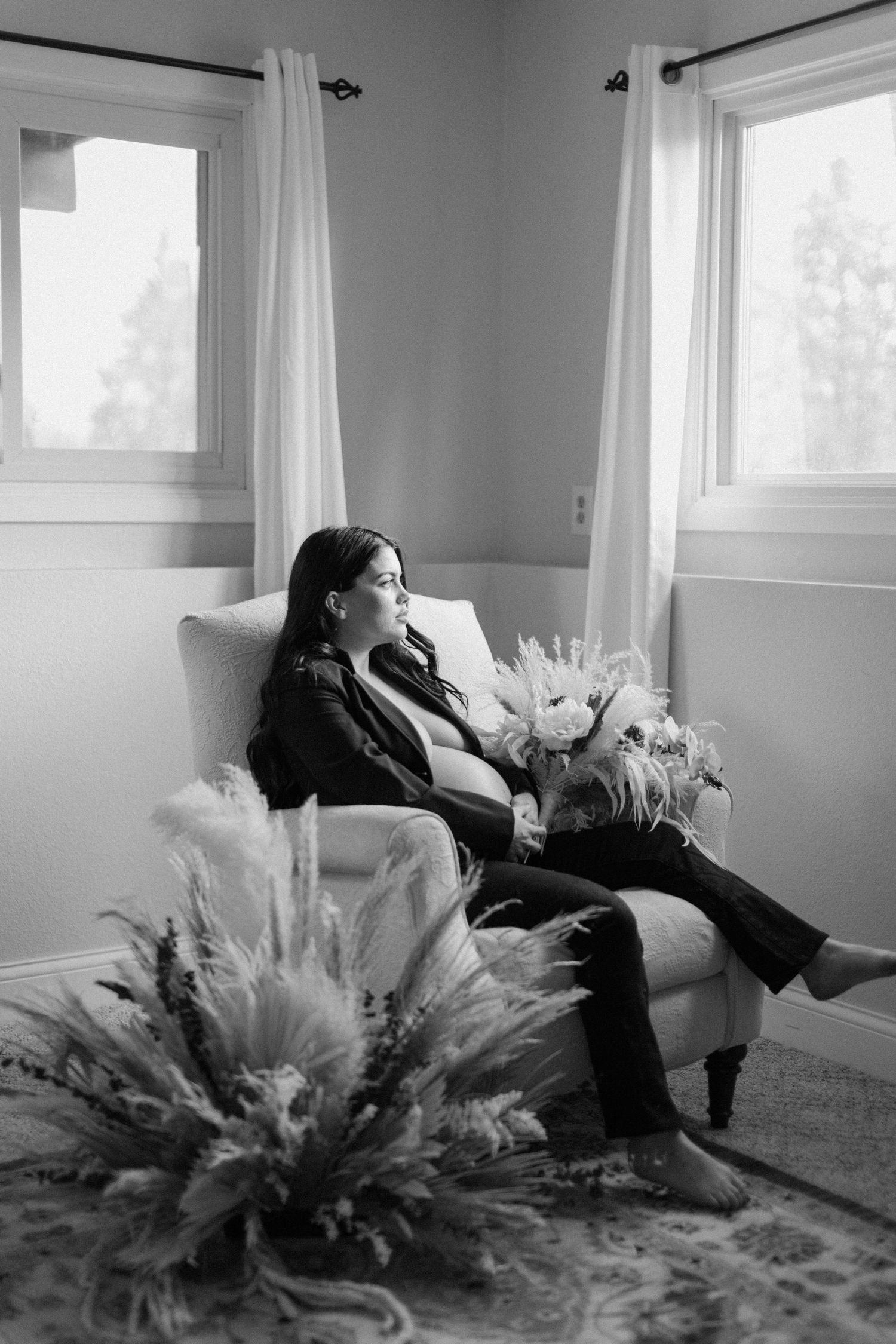 Expecting mother during an indoor maternity session in Minnesota, captured by Makayla Miranda Photo.