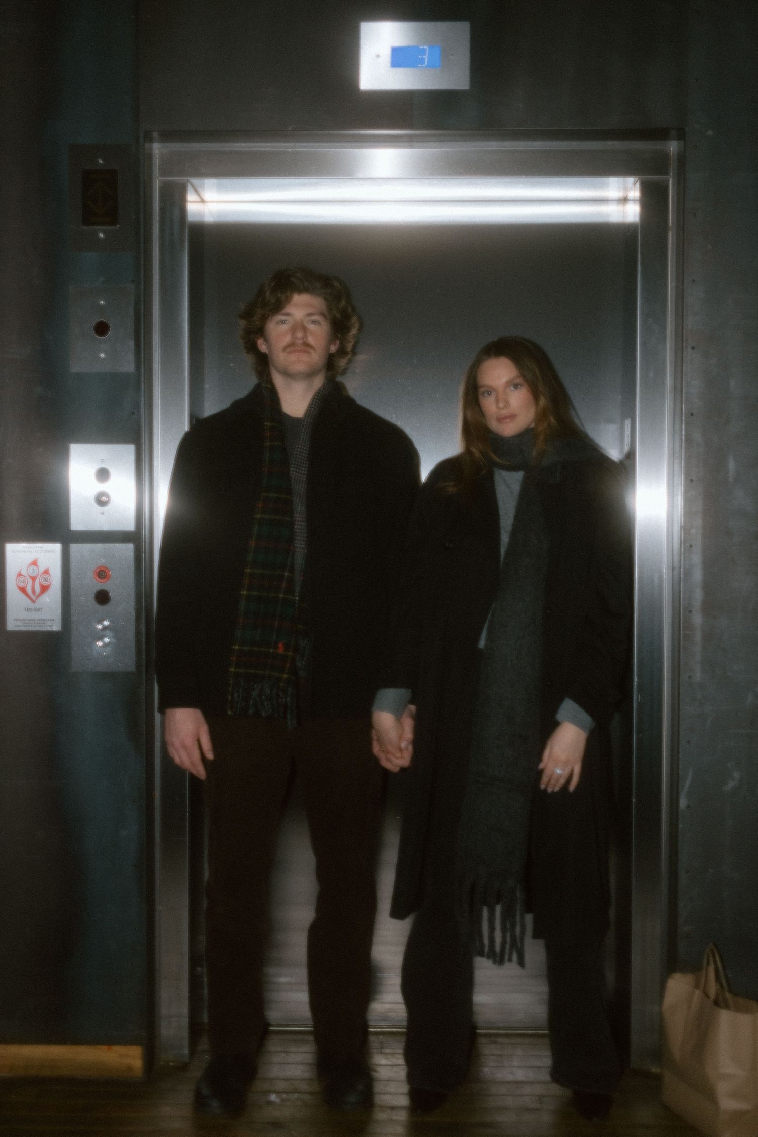 Couples session in elevator in Minneapolis, Minnesota. Captured by Makayla Miranda Photo.