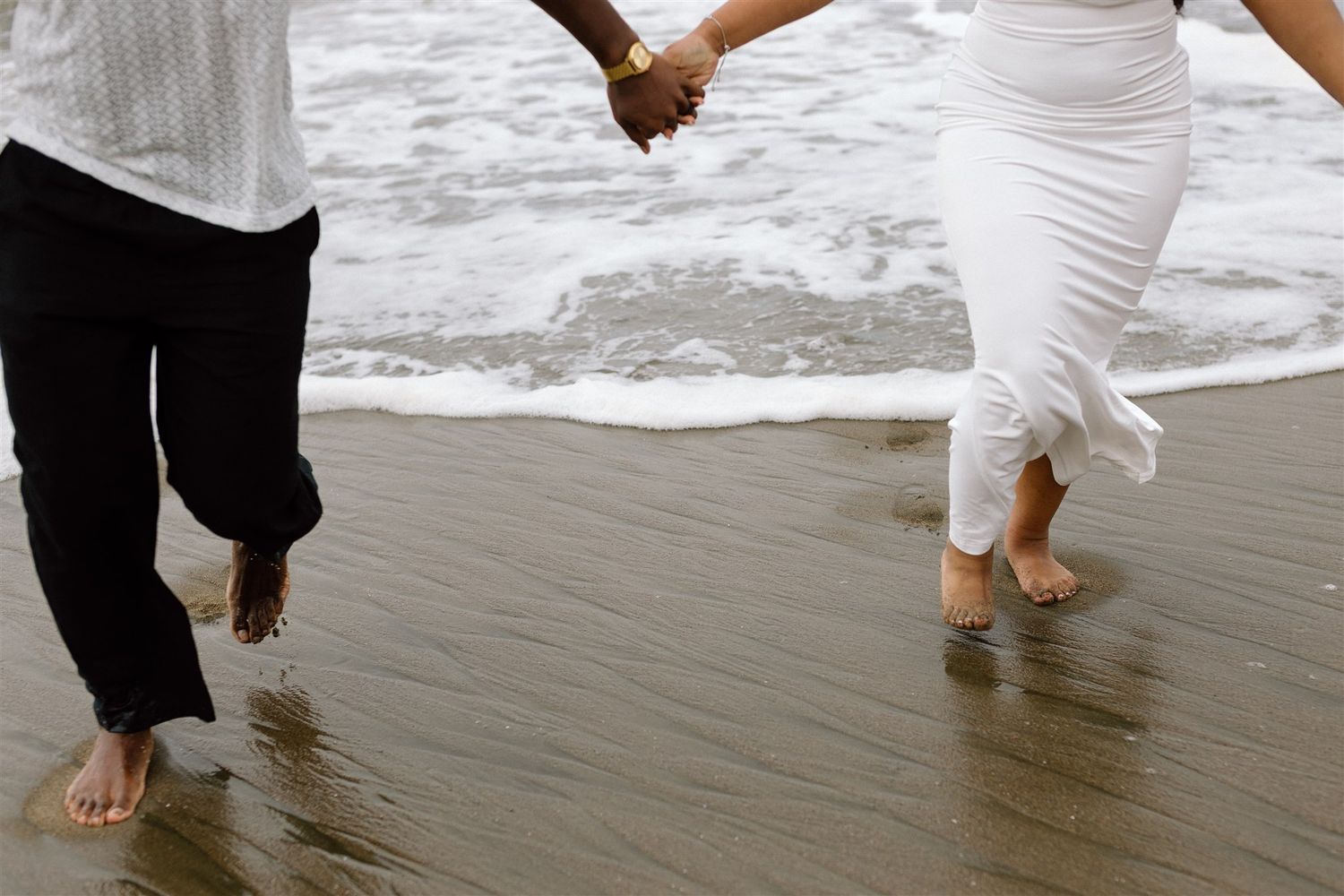 Couple posing for their engagement session at Baker Beach in San Francisco, California, captured by Makayla Miranda Photo