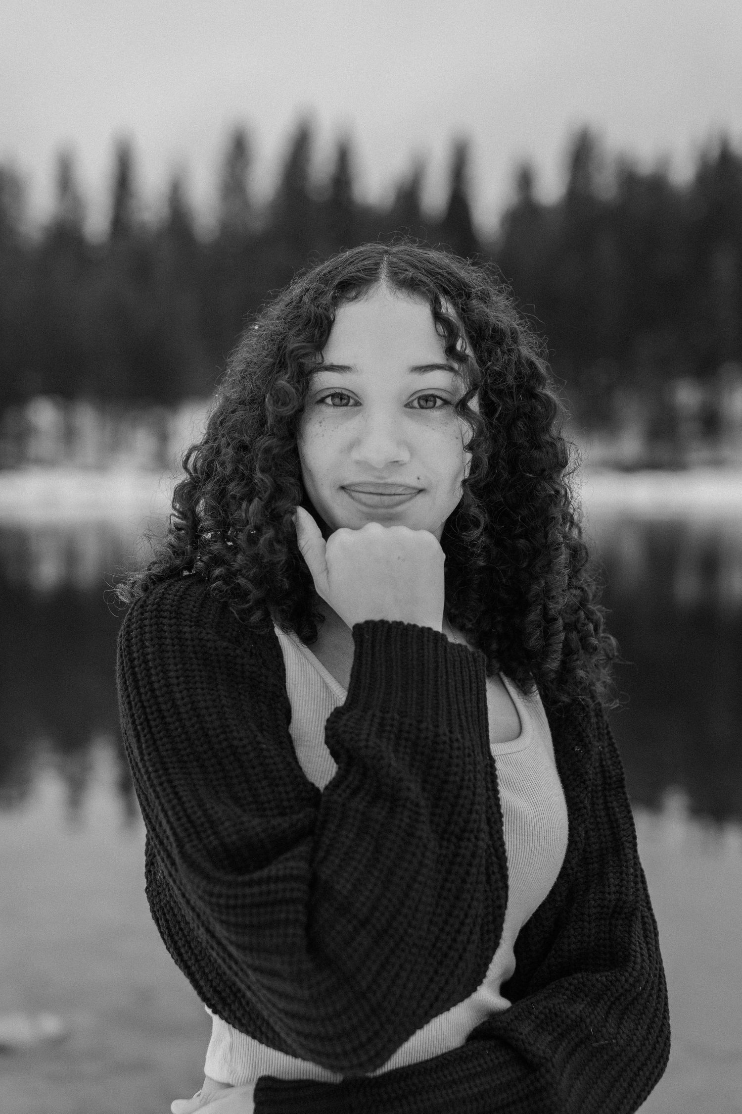 High school senior posing outdoors during a snowy portrait session in Mount Shasta, California, captured by Makayla Miranda Photo.
