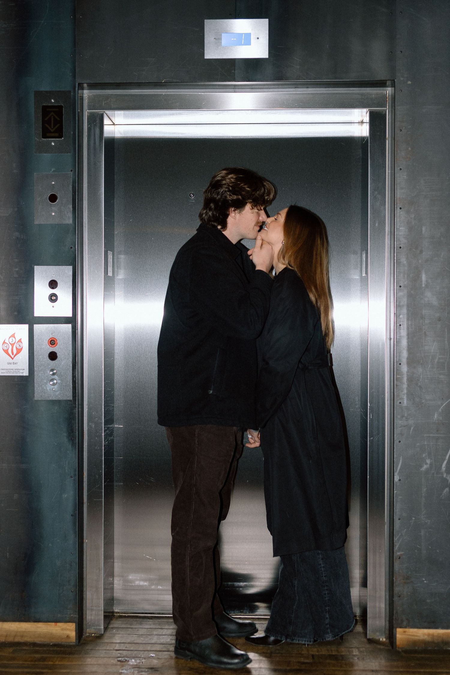 Couples session in elevator in Minneapolis, Minnesota. Captured by Makayla Miranda Photo.